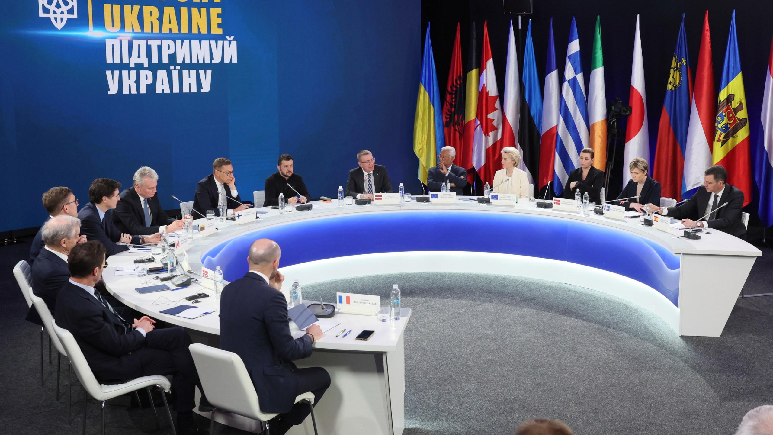 From second left by the table's sits: Sweden's Prime Minister Ulf Kristersson, Norway's Prime Minister Jonas Gahr Stoere, Estonia's Prime Minister Kristen Michal, Canada's Prime Minister Justin Trudeau, Lithuania's President Gitanas Nauseda, Finland's President Alexander Stubb, Ukrainian President Volodymyr Zelenskiy, Latvia's President Edgars Rinkevics, European Council President Antonio Costa, European Commission President Ursula von der Leyen, Denmark's Prime Minister Mette Frederiksen, Iceland's Prime Minister Kristrun Frostadottir, Spain's Prime Minister Pedro Sanchez attend a press conference after the "Support Ukraine" summit, marking the third anniversary of the Russian invasion, in Kyiv, Ukraine, Feb. 24, 2025. (Gleb Garanich/Pool Photo via AP)