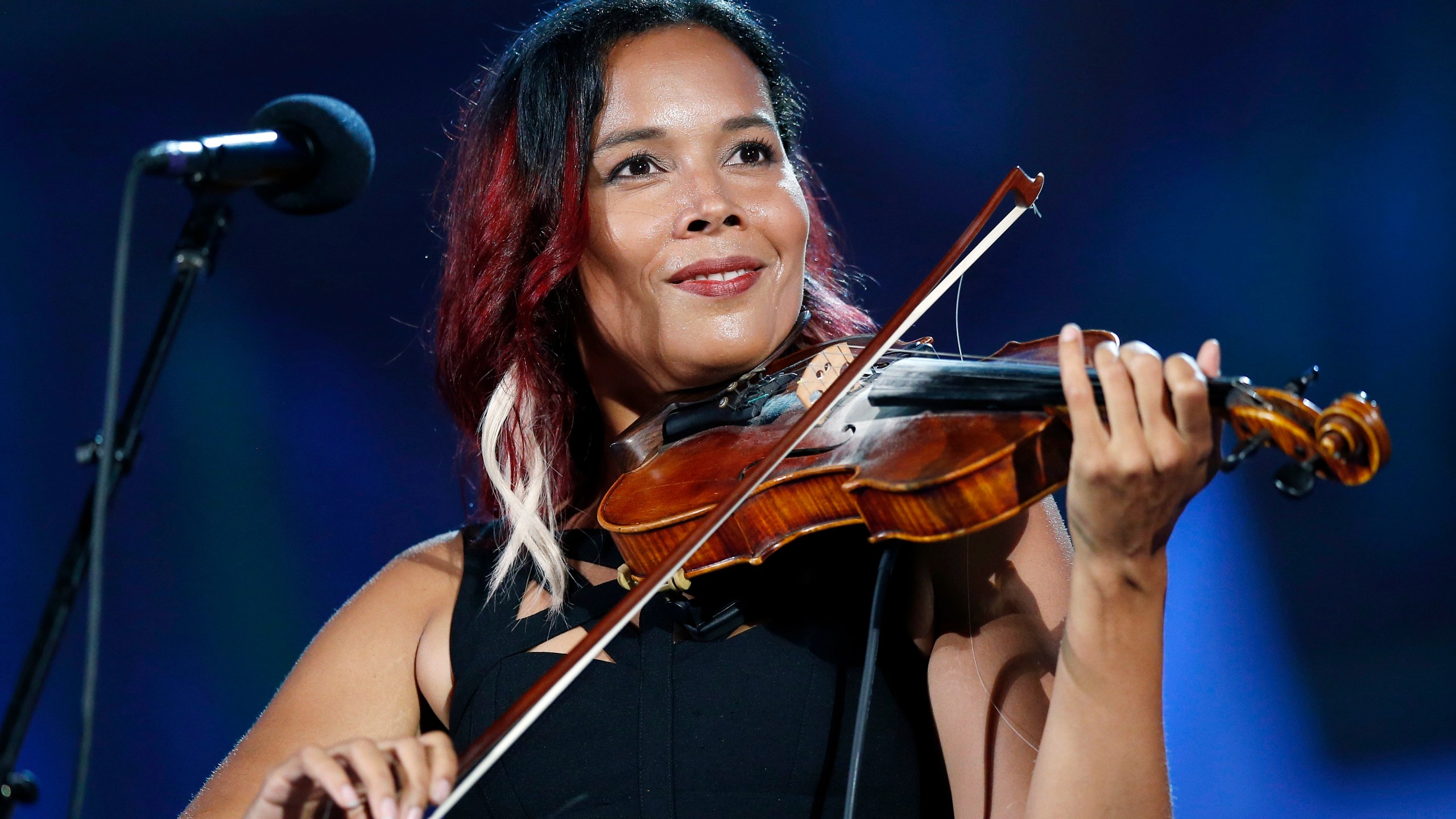 FILE - Rhiannon Giddens performs during rehearsal for the Boston Pops Fireworks Spectacular in Boston, on July 3, 2018. (AP Photo/Michael Dwyer, File)
