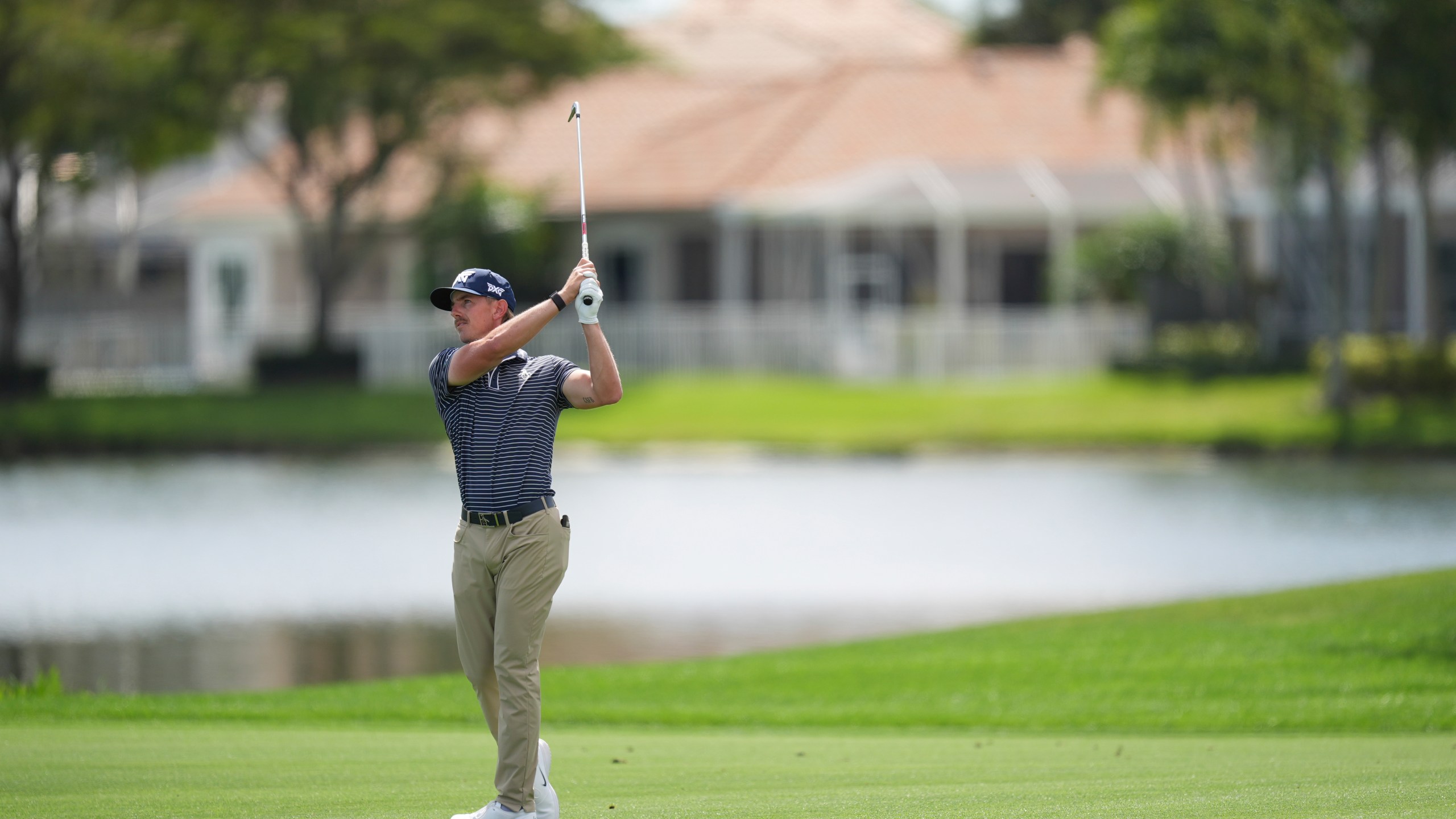 Jake Knapp hits on the 18th hole during the first round of the Cognizant Classic golf tournament, Thursday, Feb. 27, 2025, in Palm Beach Gardens, Fla. (AP Photo/Rebecca Blackwell)