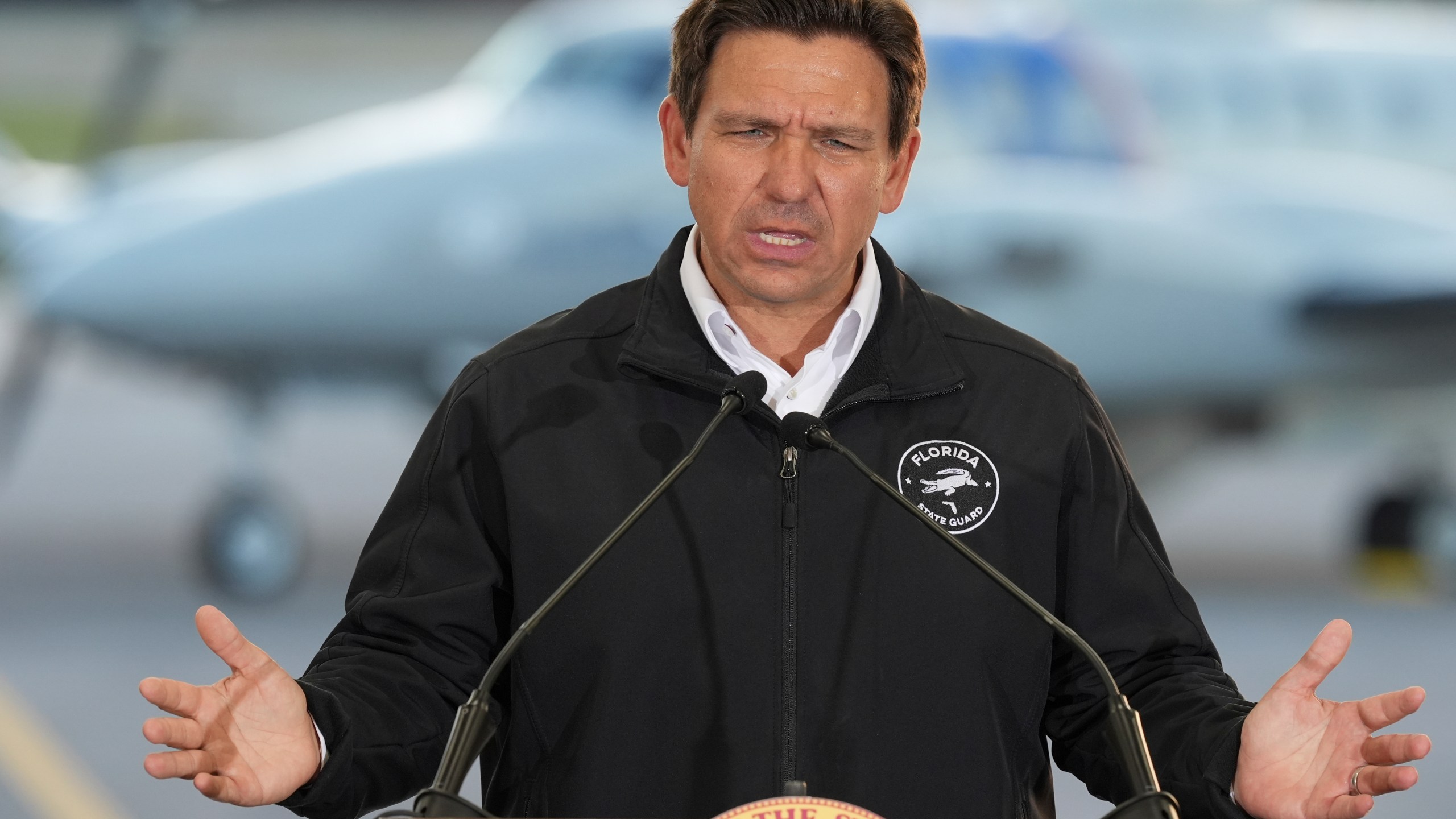 Ron DeSantis speaking from a podium