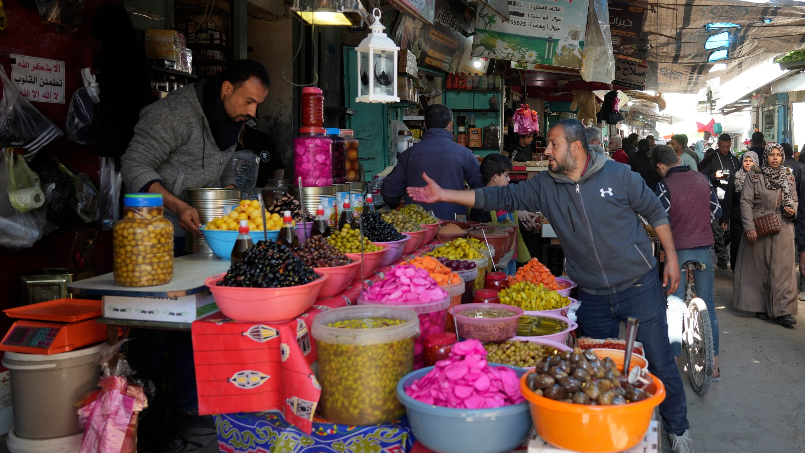 Palestinians shop for provisions ahead of the start of the Muslim holy month of Ramadan in Gaza City, Gaza Strip, Friday, Feb. 28, 2025. (AP Photo/Abdel Kareem Hana)