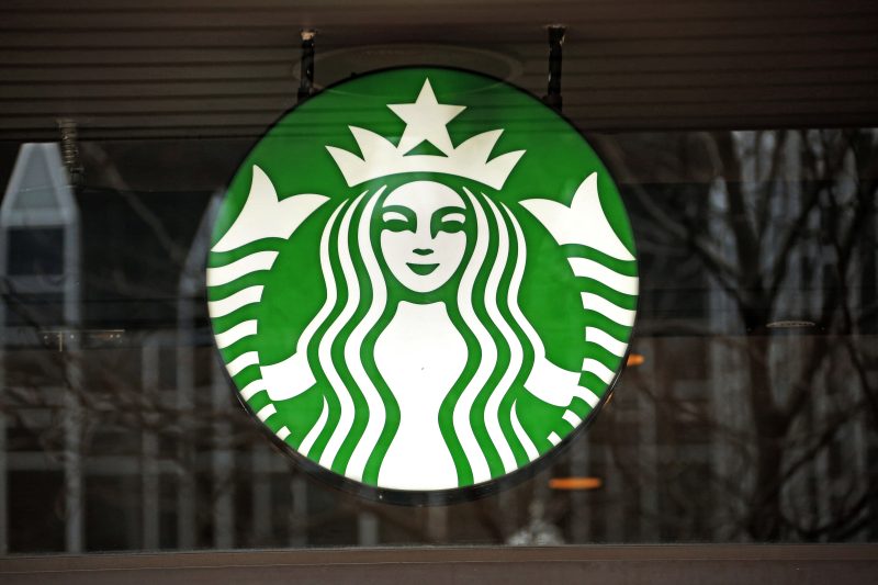 A Starbucks logo sign in a window
