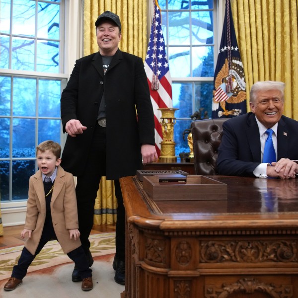 Elon Musk speaking alongside Donald Trump in the Oval Office