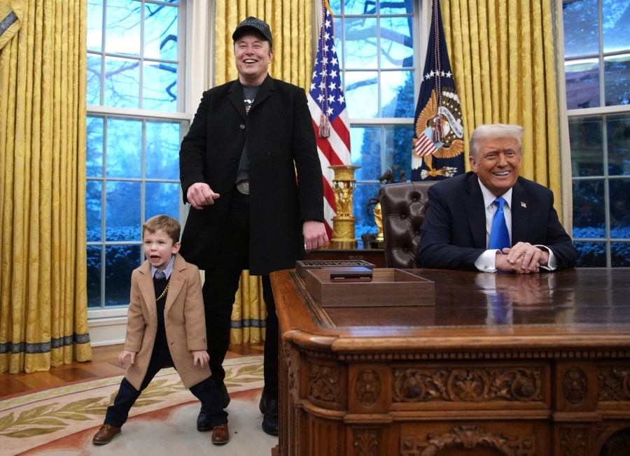 Elon Musk speaking alongside Donald Trump in the Oval Office