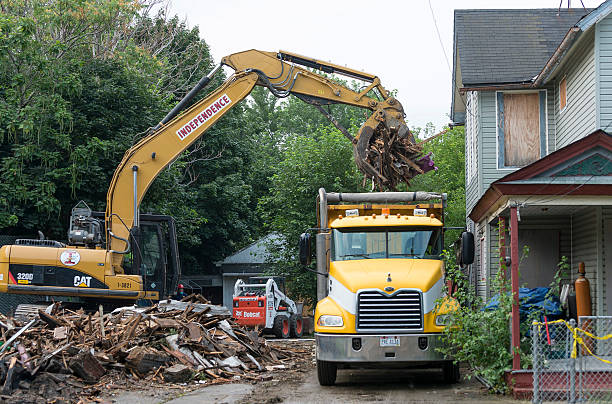  Demoliton crews clean up the remains of Ariel Castro's home after it was torn down on Aug.7, 2013 in Cleveland, Ohio.  