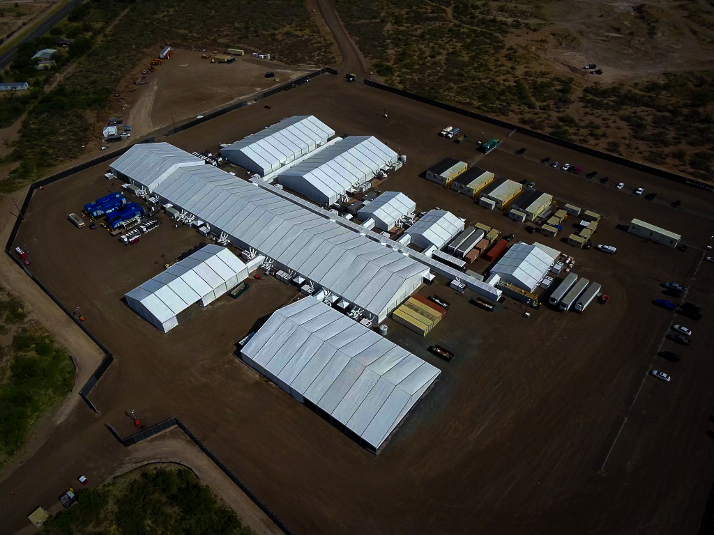 An aerial view of a migrant processing facility
