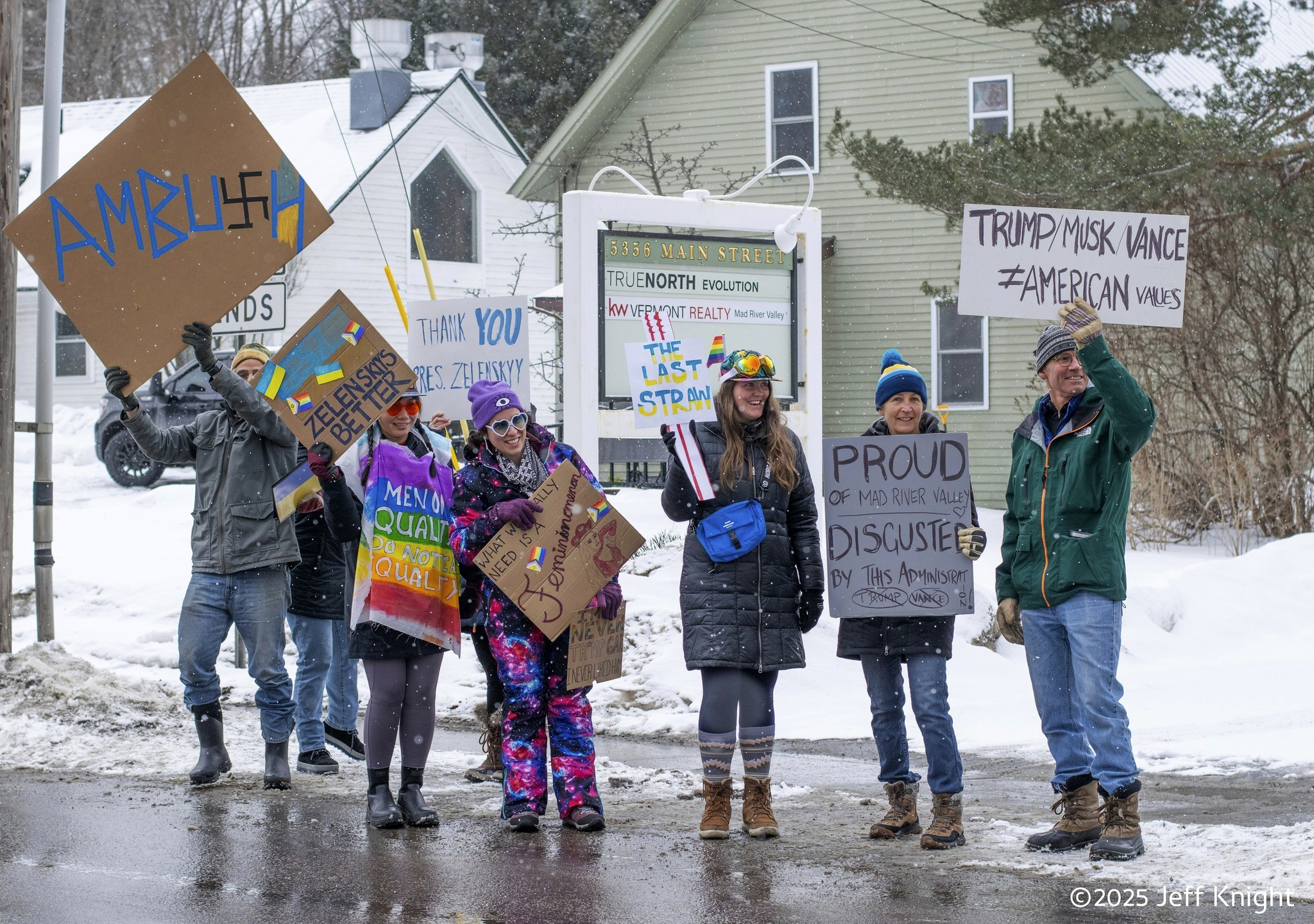Protesters of Vice President JD Vance are seen on Main Street, Rt. 100, in Waitsfield, Vermont on Saturday, March 1, 2025. (Jeff Knight/The Valley Reporter via AP)
