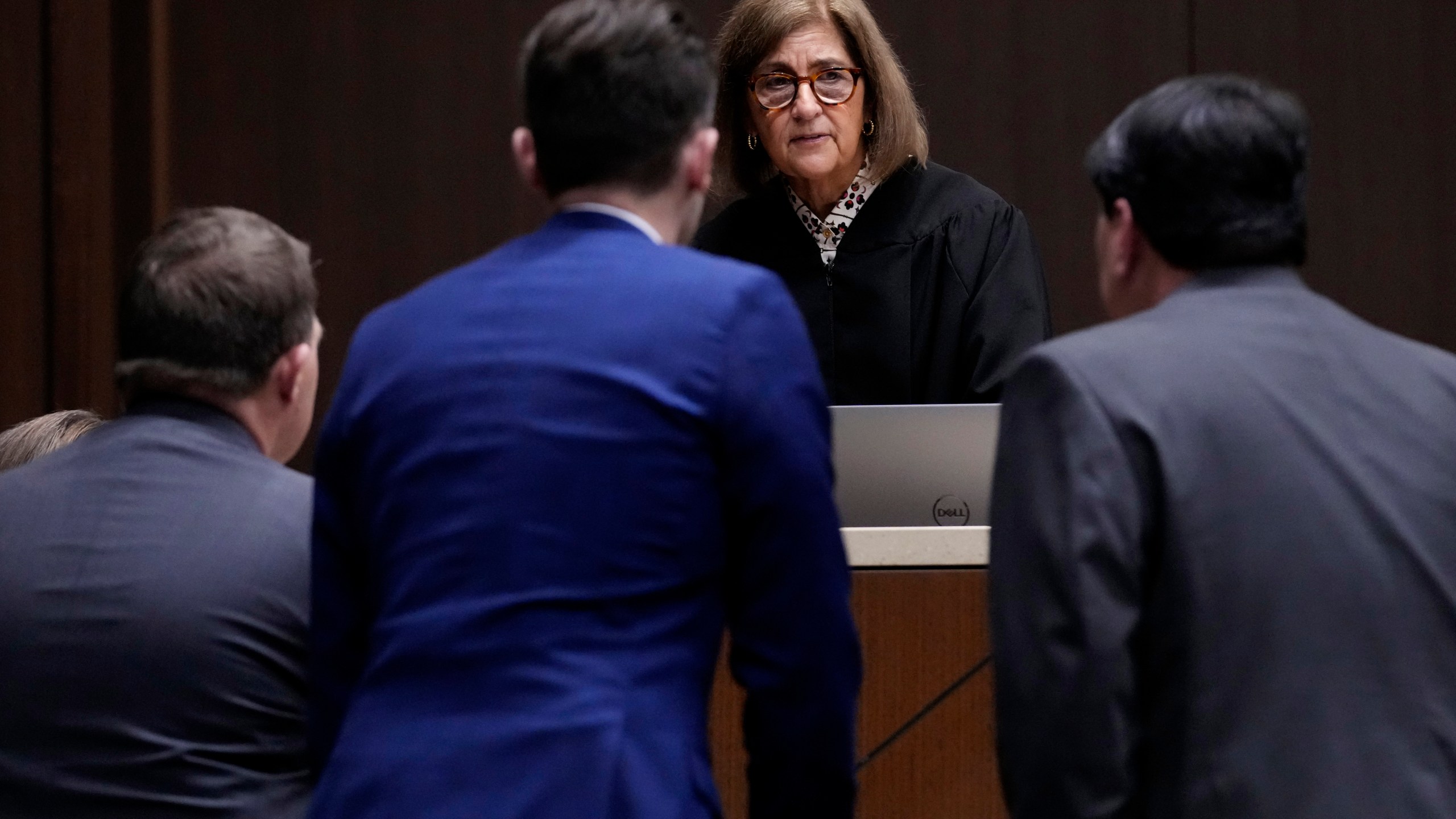 FILE - Judge Victoria A. Rossetti, second from right, talks to Robert E. Crimo III's attorney Gregory Ticsay, right, Lake County's assistant public defender Anton Trizna, second from left, and Lake County, Ill., State's Attorney Eric Rinehart during the jury selection for the trial of Robert E. Crimo III., at the Lake County Courthouse, Waukegan, Ill., Monday, Feb. 24, 2025. (AP Photo/Nam Y. Huh, Pool, File)