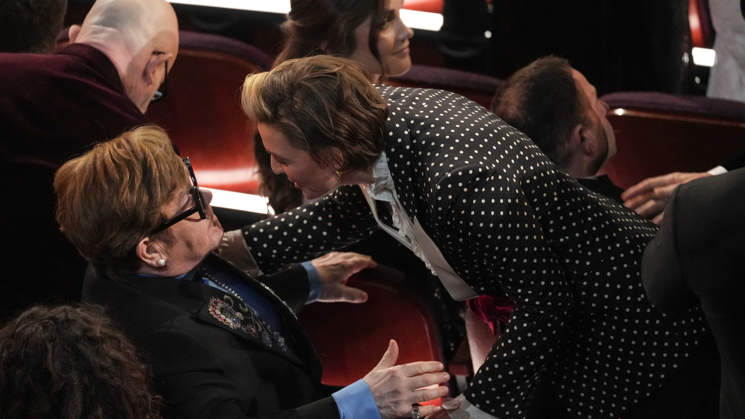 Elton John, left, and Brandi Carlile in the audience during the Oscars on Sunday, March 2, 2025, at the Dolby Theatre in Los Angeles. (AP Photo/Chris Pizzello)