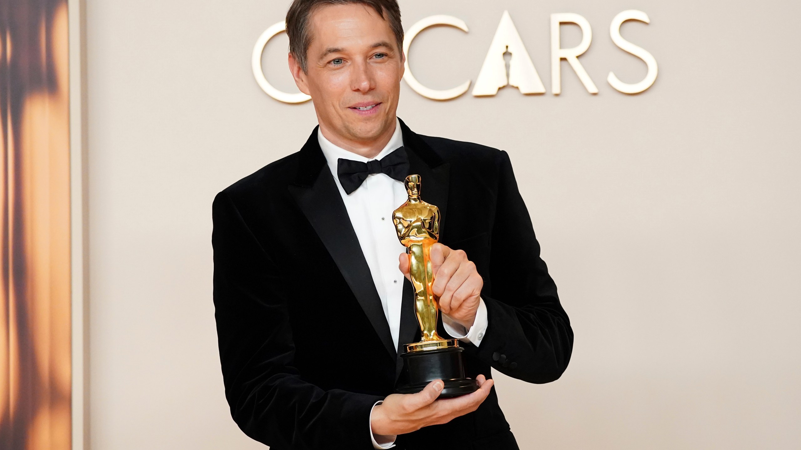 Sean Baker, winner of the award for best film editing for "Anora," poses in the press room at the Oscars on Sunday, March 2, 2025, at the Dolby Theatre in Los Angeles. (Photo by Jordan Strauss/Invision/AP)