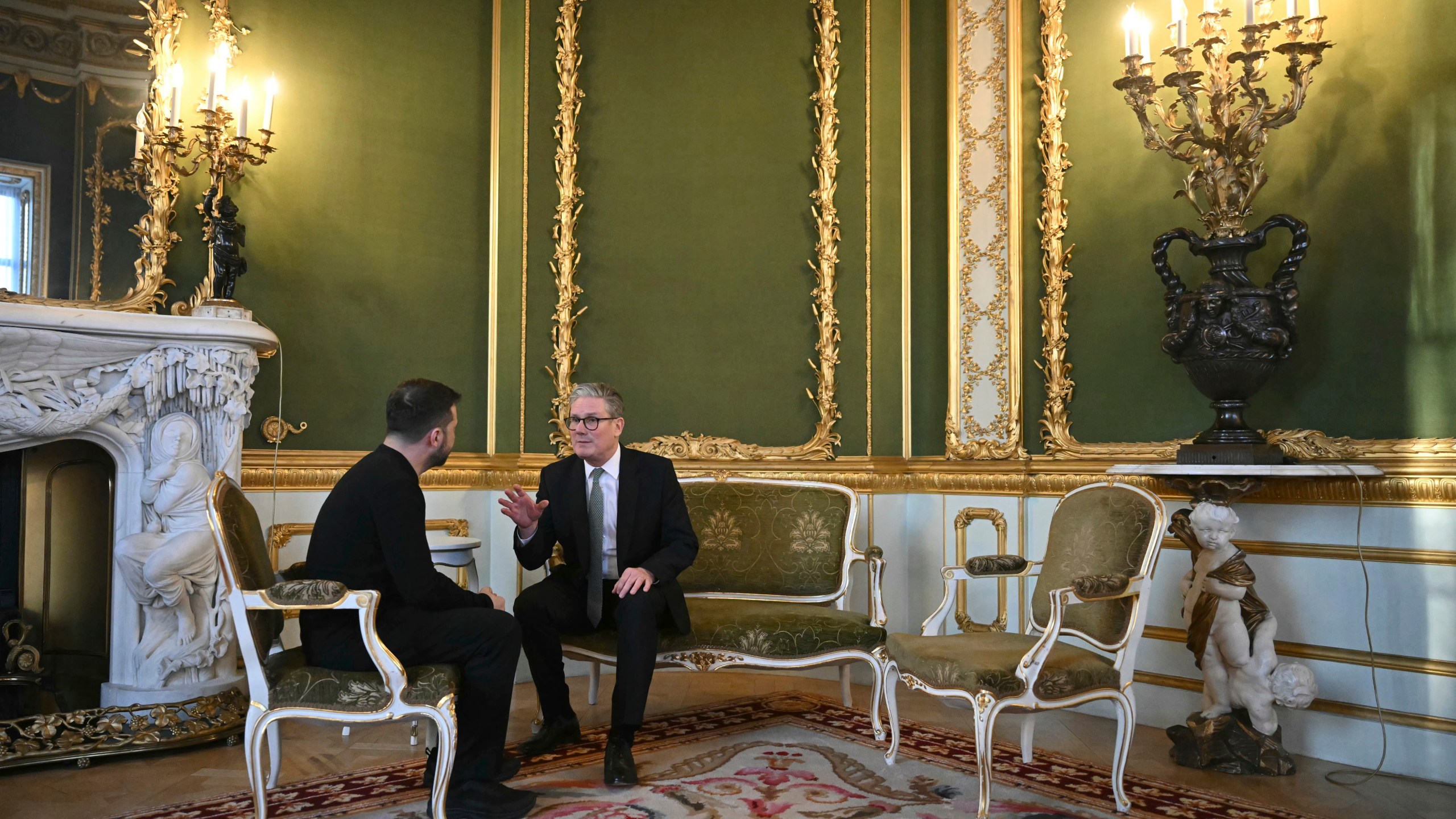 Britain's Prime Minister Keir Starmer, right, and Ukraine's President Volodymyr Zelenskyy meet during the European leaders' summit to discuss Ukraine, hosted by Britain's Prime Minister Keir Starmer, at Lancaster House, London, Sunday March 2, 2025. (Justin Tallis/Pool via AP)