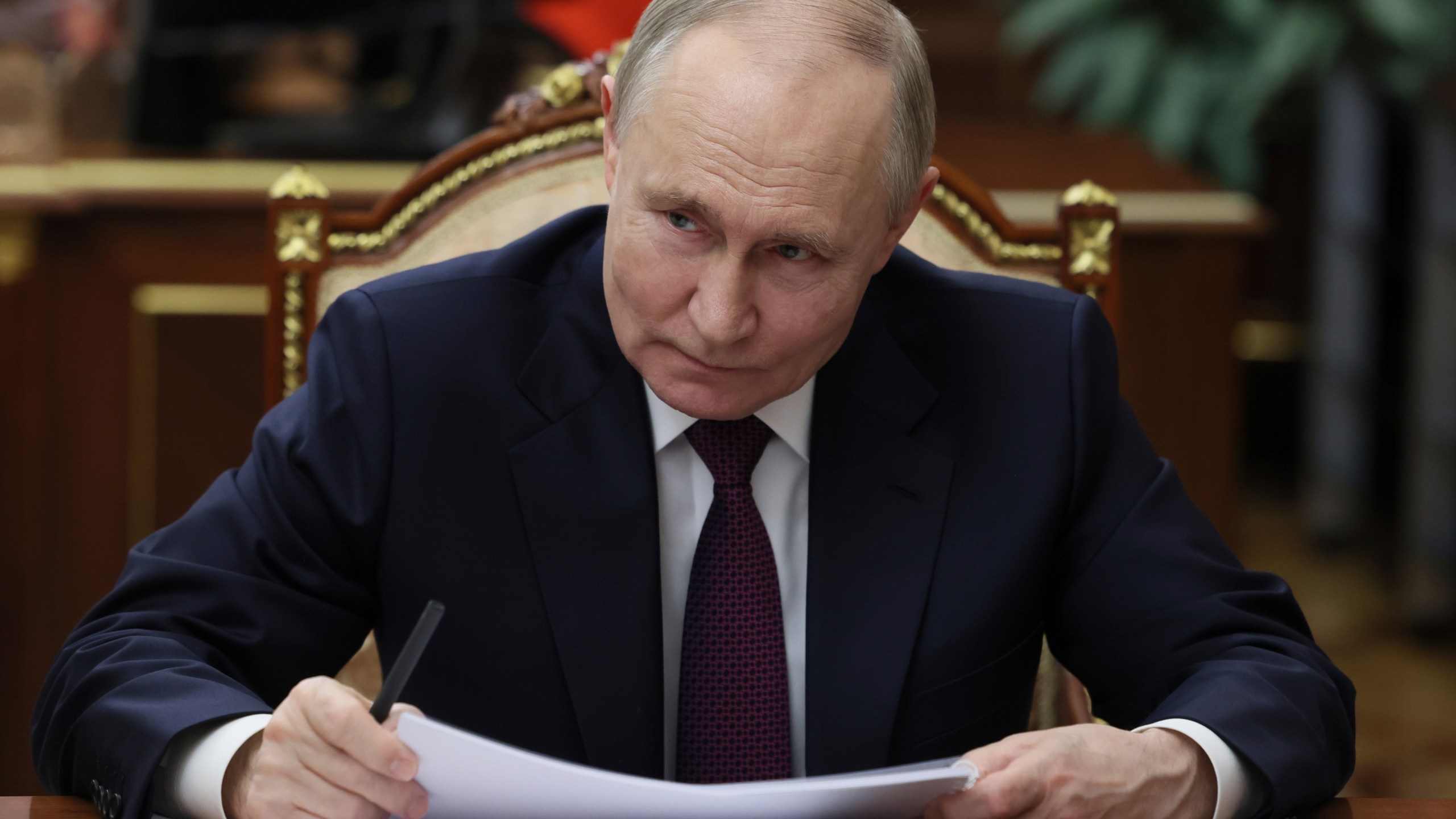 Russian President Vladimir Putin listens to the Head of Republic of Tatarstan Rustam Minnikhanov during their meeting at the Kremlin in Moscow, Russia, Monday, March 3, 2025. (Mikhail Metzel, Sputnik, Kremlin Pool Photo via AP)