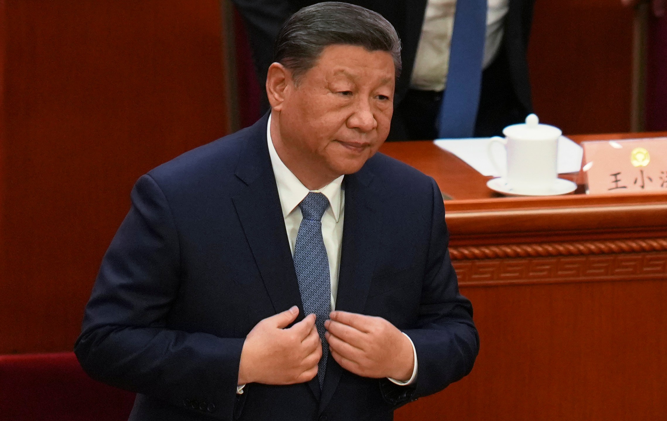 Chinese President Xi Jinping stands for the national anthem during the opening of the Chinese People's Political Consultative Conference held at the Great Hall of the People in Beijing, Tuesday, March 4, 2025. (AP Photo/Ng Han Guan)