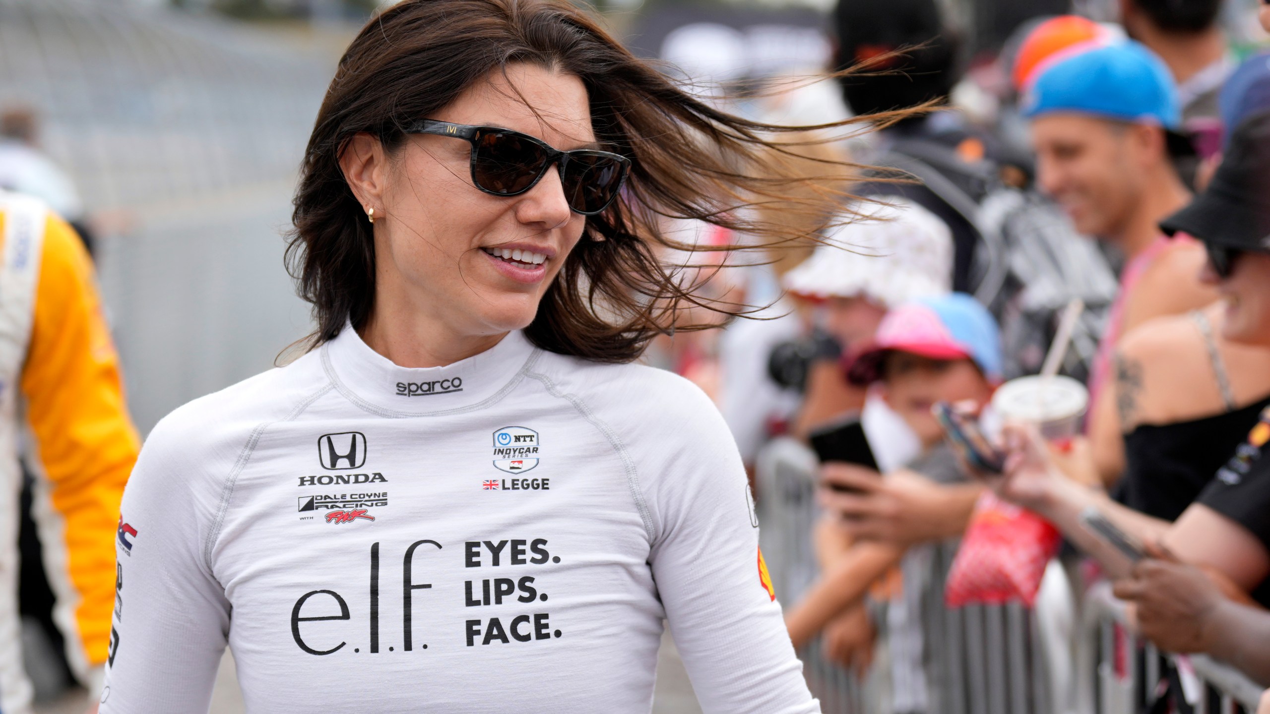 FILE - Katherine Legge greets fans before an IndyCar auto race, Sept. 15, 2024, at the Nashville Superspeedway in Lebanon, Tenn. (AP Photo/Mark Humphrey, File)