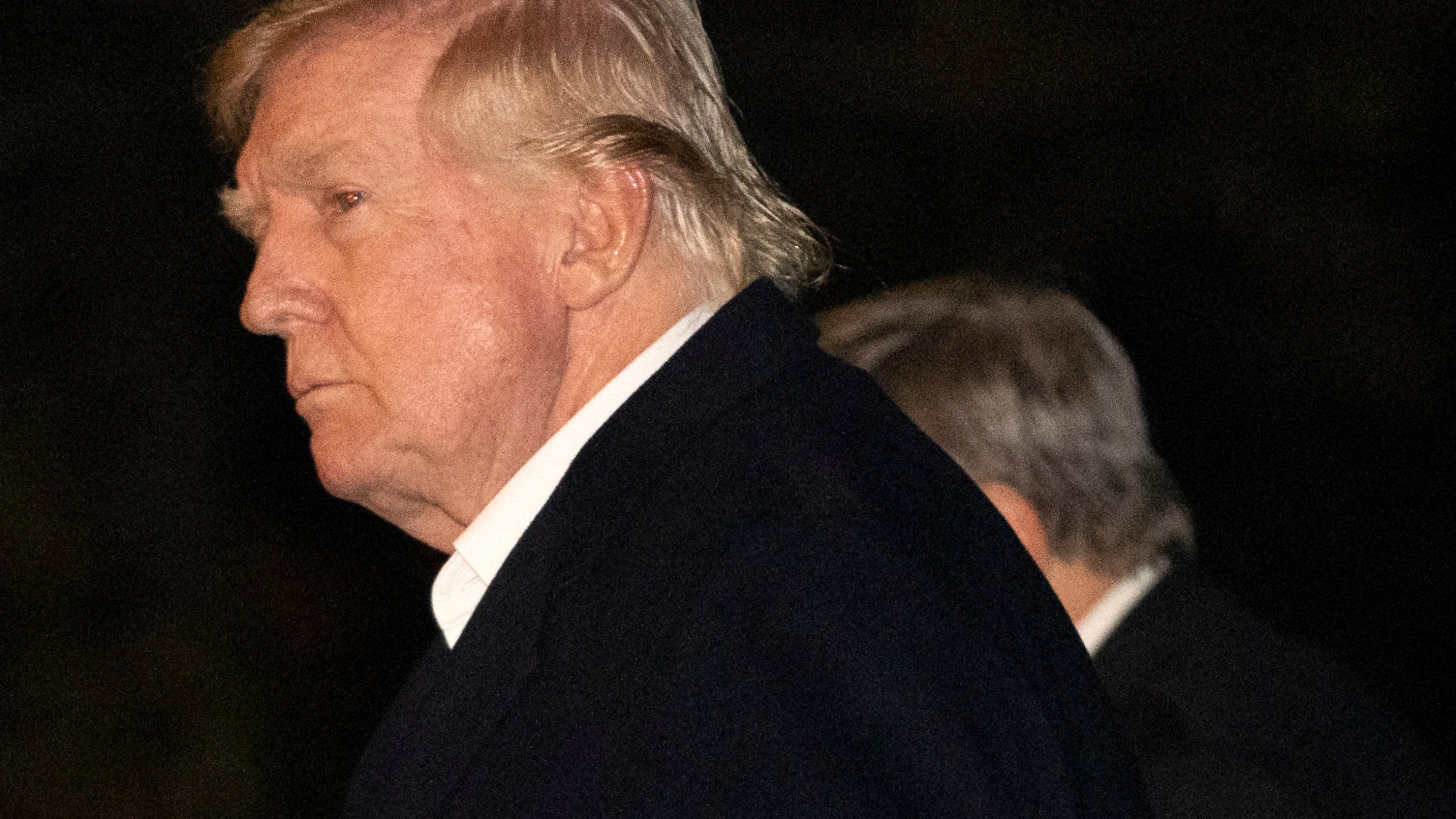 President Donald Trump walks across the South Lawn of the White House, Sunday, March 2, 2025, in Washington, after returning from a trip to Florida. (AP Photo/Mark Schiefelbein)