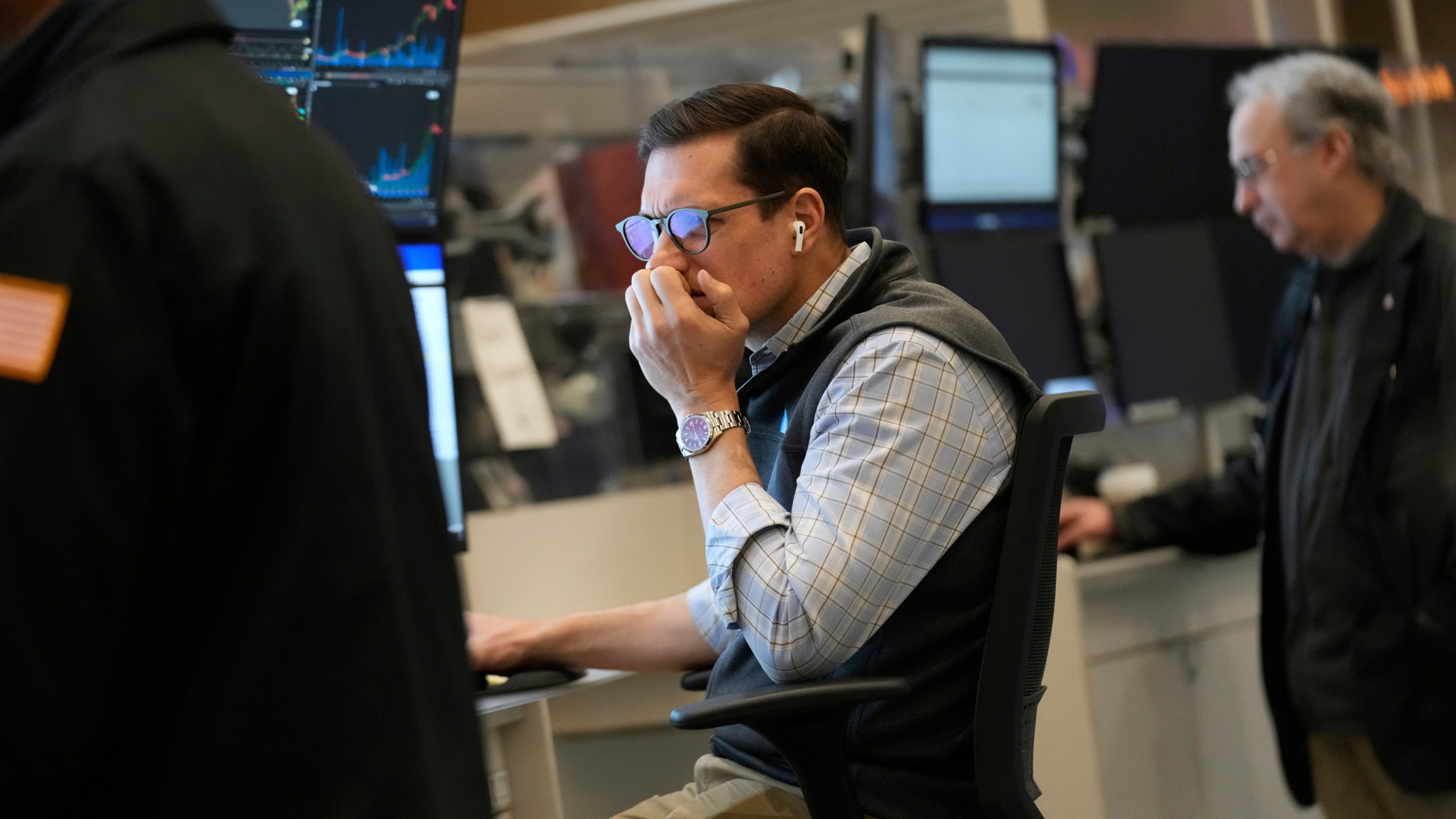 People work on the options floor at the New York Stock Exchange in New York, Tuesday, March 4, 2025. (AP Photo/Seth Wenig)