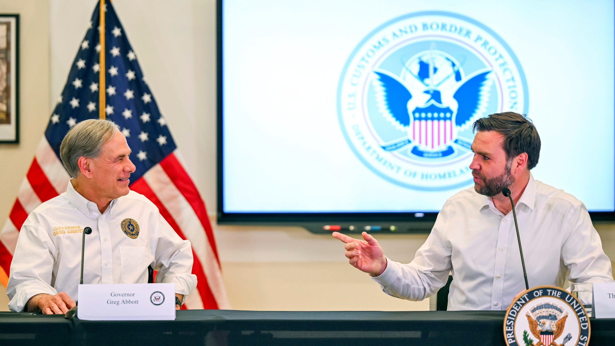 Vice President JD Vance talks with Texas Gov. Greg Abbott at the Border Patrol Station South during a visit to the U.S. border with Mexico Wednesday, March 5, 2025 in Eagle Pass, Texas. (Brandon Bell/Pool via AP)