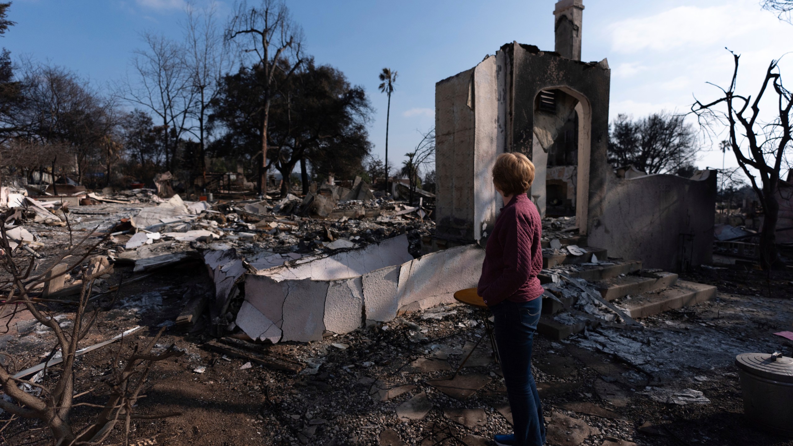 Louise Hamlin visits her home ravaged by the Eaton Fire in Altadena, Calif., Thursday, Jan. 30, 2025.