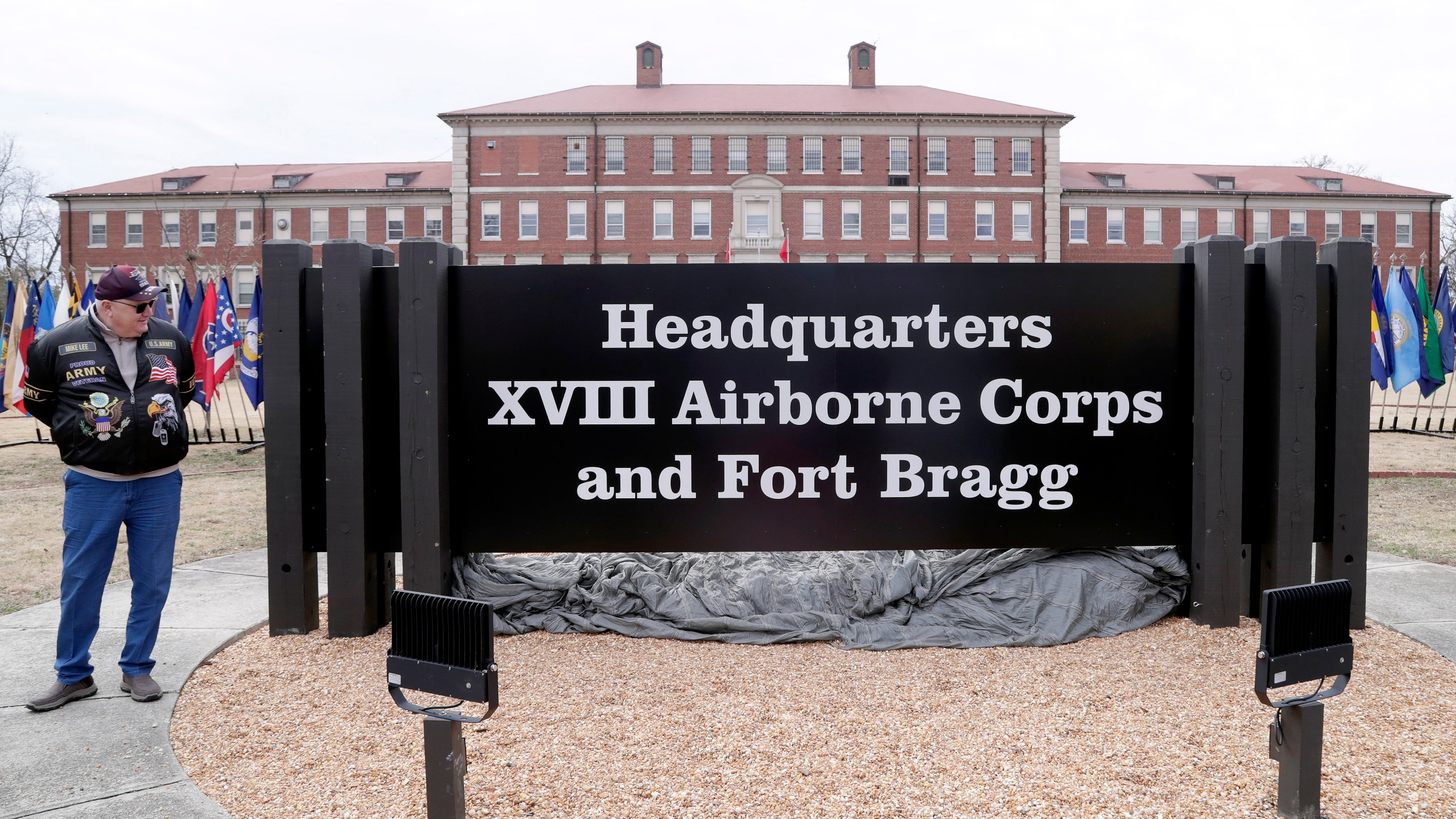 U.S. Army veteran Sgt. Mike Lee, who served at Fort Bragg, looks at the sign that was unveiled when Fort Liberty was rededicated as Fort Bragg during a ceremony on base, Friday, March 7, 2025, (AP Photo/Chris Seward)