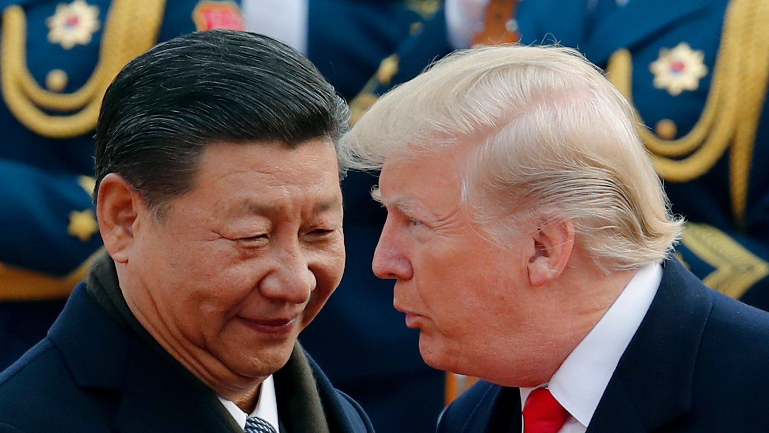 President Donald Trump chats with Chinese President Xi Jinping