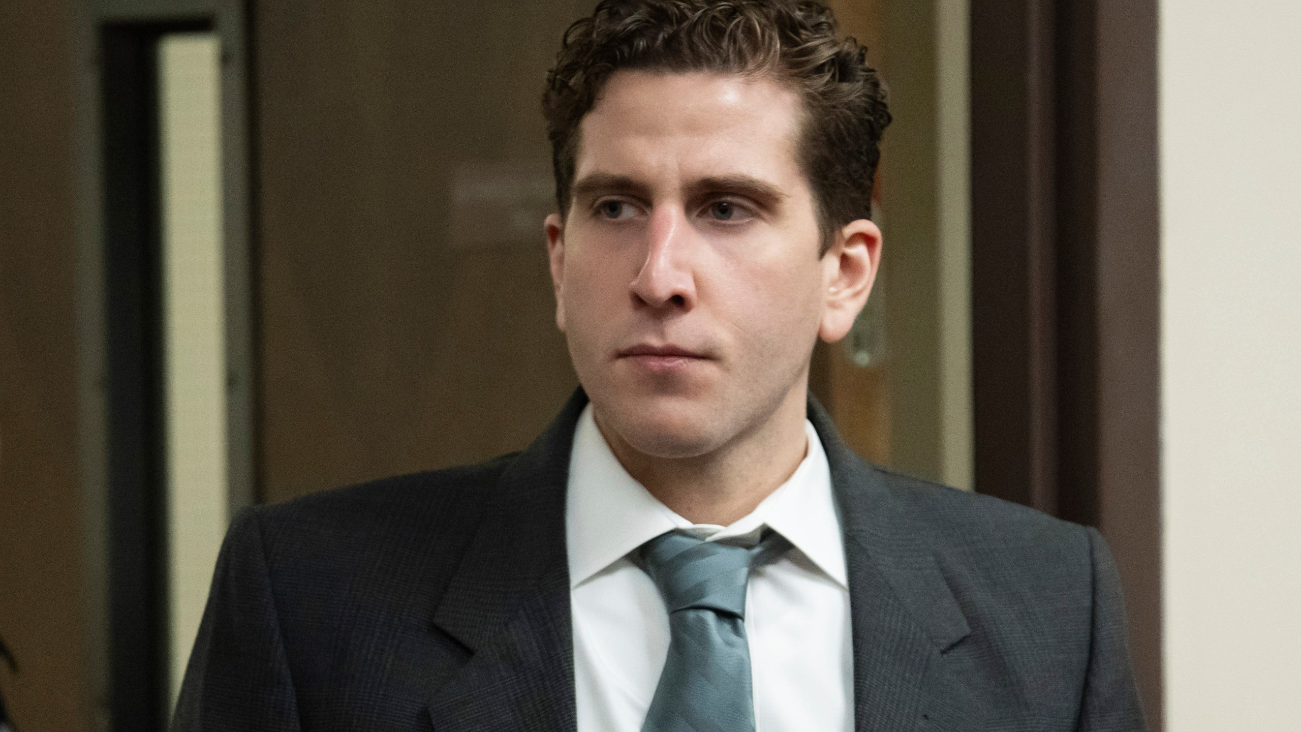 Bryan Kohberger is escorted into a courtroom