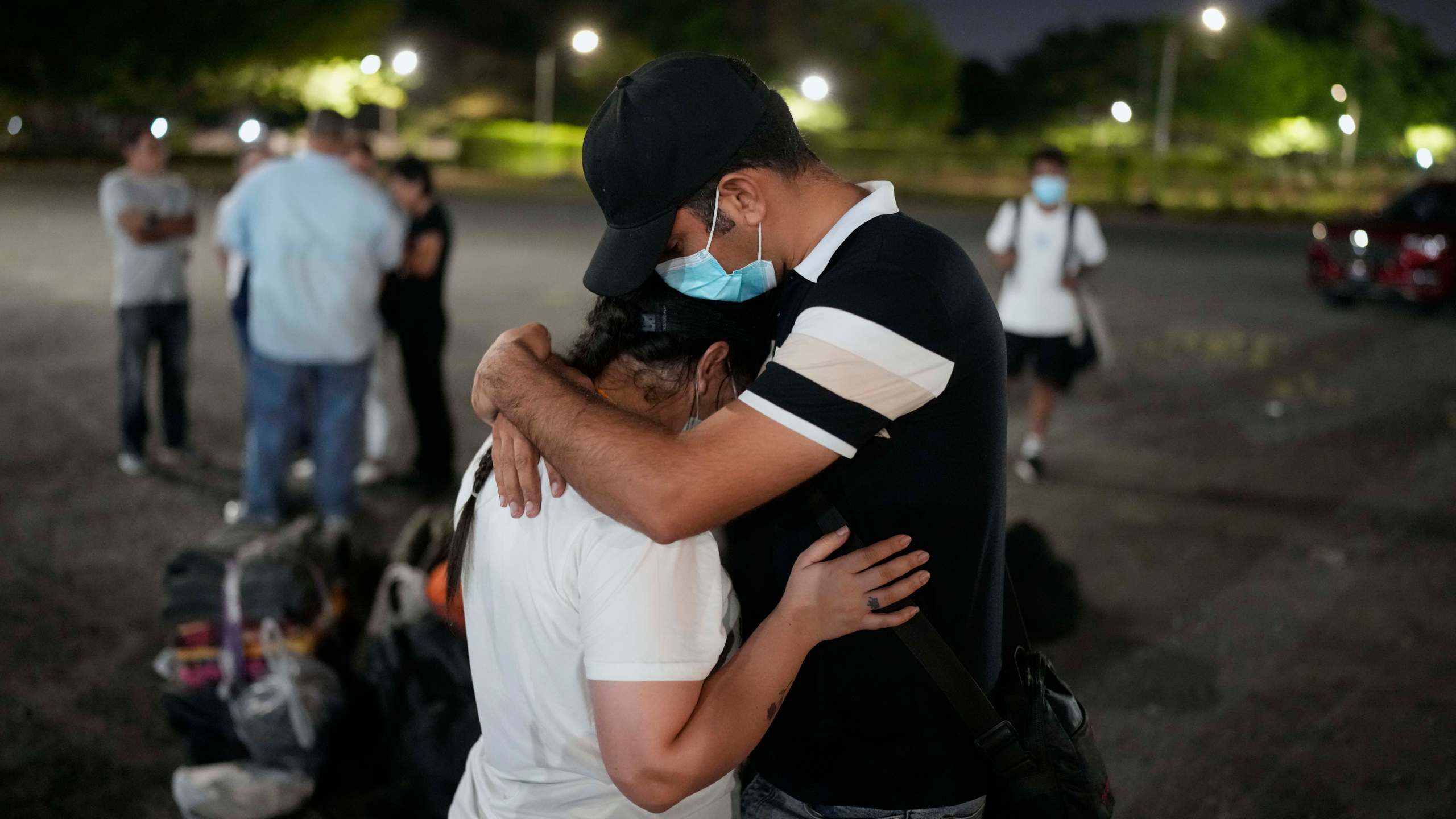 Migrants who were held in a Panamanian immigration shelter after being deported from the U.S. embraced upon arriving in Panama City on Saturday, March 8, 2025, after authorities gave them 30 days to leave the country. (AP Photo/Matias Delacroix)