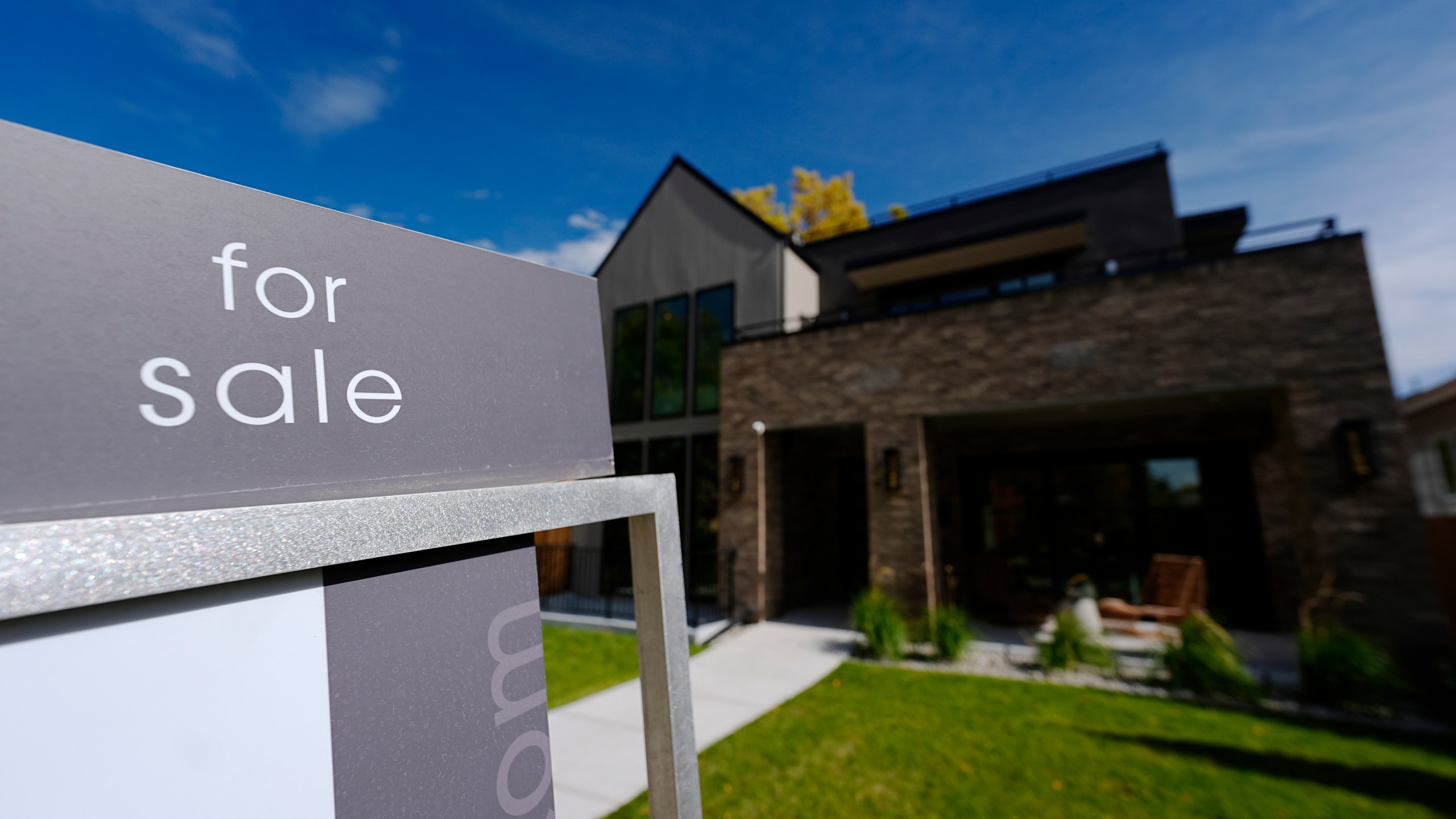FILE - A sale sign stands outside a home on Thursday, Oct. 17, 2024, in the east Washington Park neighborhood of Denver. (AP Photo/David Zalubowski, File)