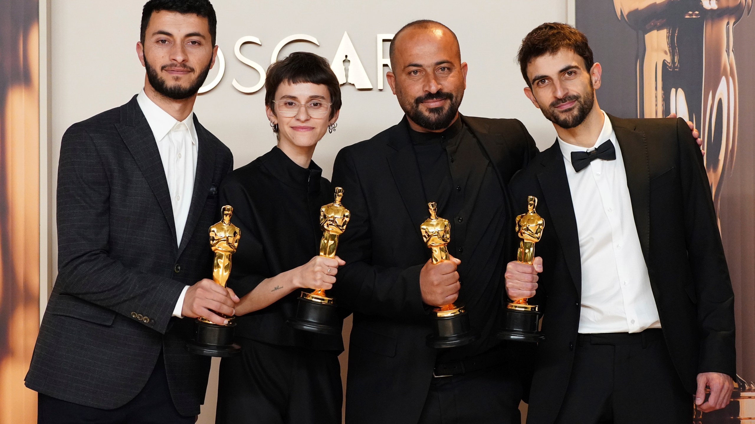 Basel Adra, from left, Rachel Szor, Hamdan Ballal, and Yuval Abraham, winners of the award for best documentary feature film for "No Other Land," pose in the press room at the Oscars on Sunday, March 2, 2025, at the Dolby Theatre in Los Angeles. (Photo by Jordan Strauss/Invision/AP)