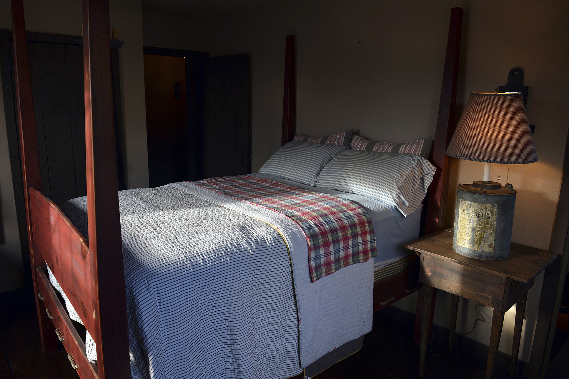 FILE - A shaft of light shines into a bedroom in Belle, W.Va., on Nov. 11, 2013. (Craig Cunningham/The Daily Mail via AP, File)