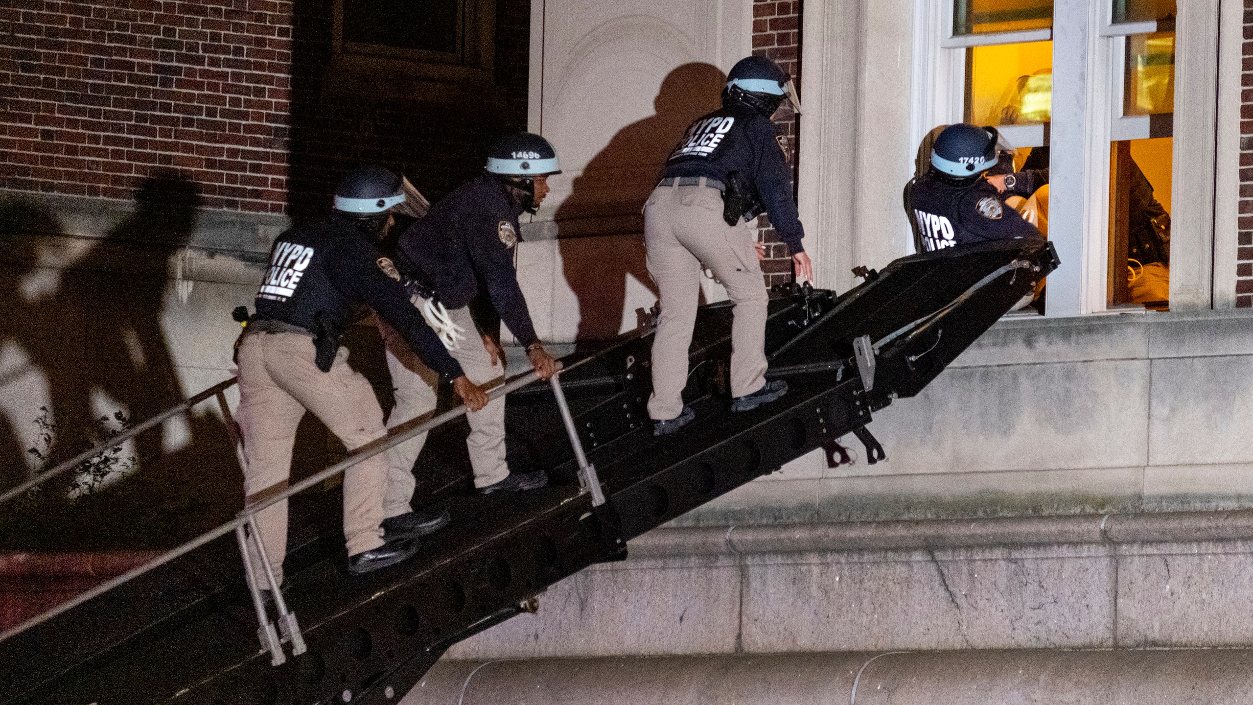 FILE - Using a tactical vehicle, New York City police enter an upper floor of Hamilton Hall on the Columbia University campus in New York, Tuesday, April 30, 2024, after the building was taken over by protesters earlier in the day. (AP Photo/Craig Ruttle, File)