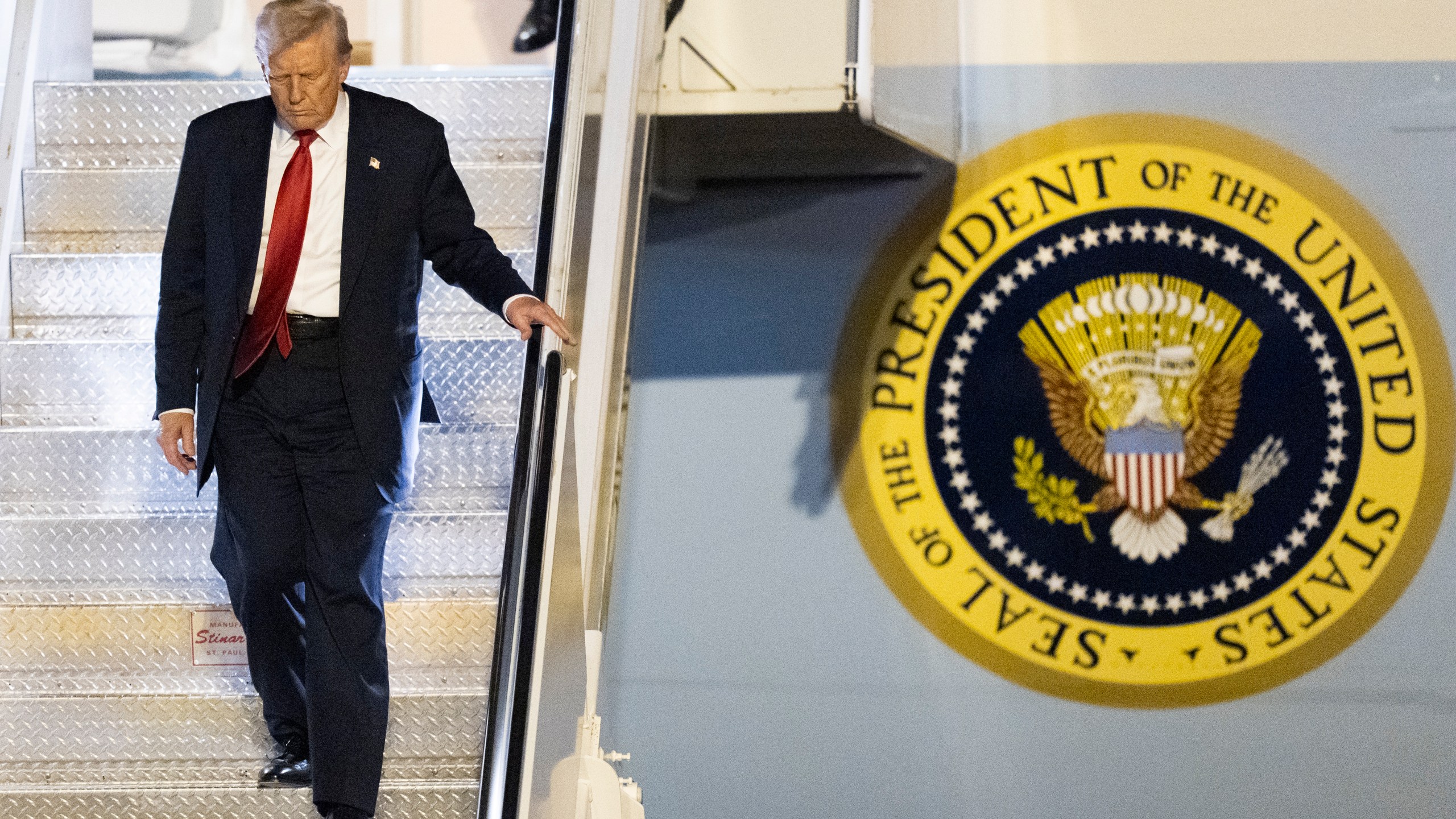 President Donald Trump arrives on Air Force One at Palm Beach International Airport, Friday, March 14, 2025, in West Palm Beach, Fla. (AP Photo/Manuel Balce Ceneta)