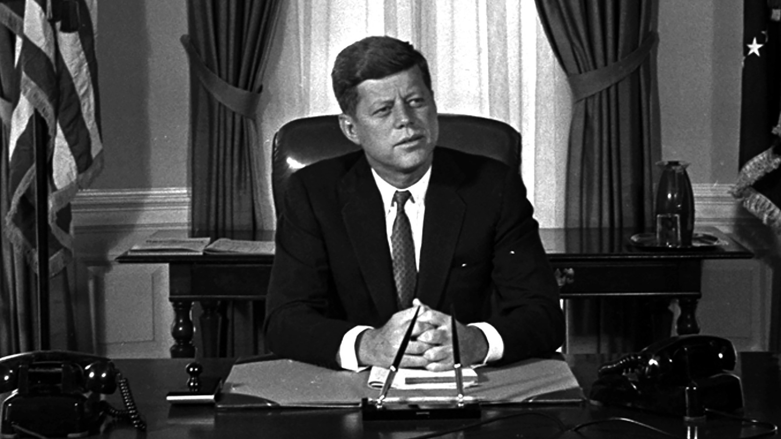 President Kennedy posed for first pictures at his White House desk