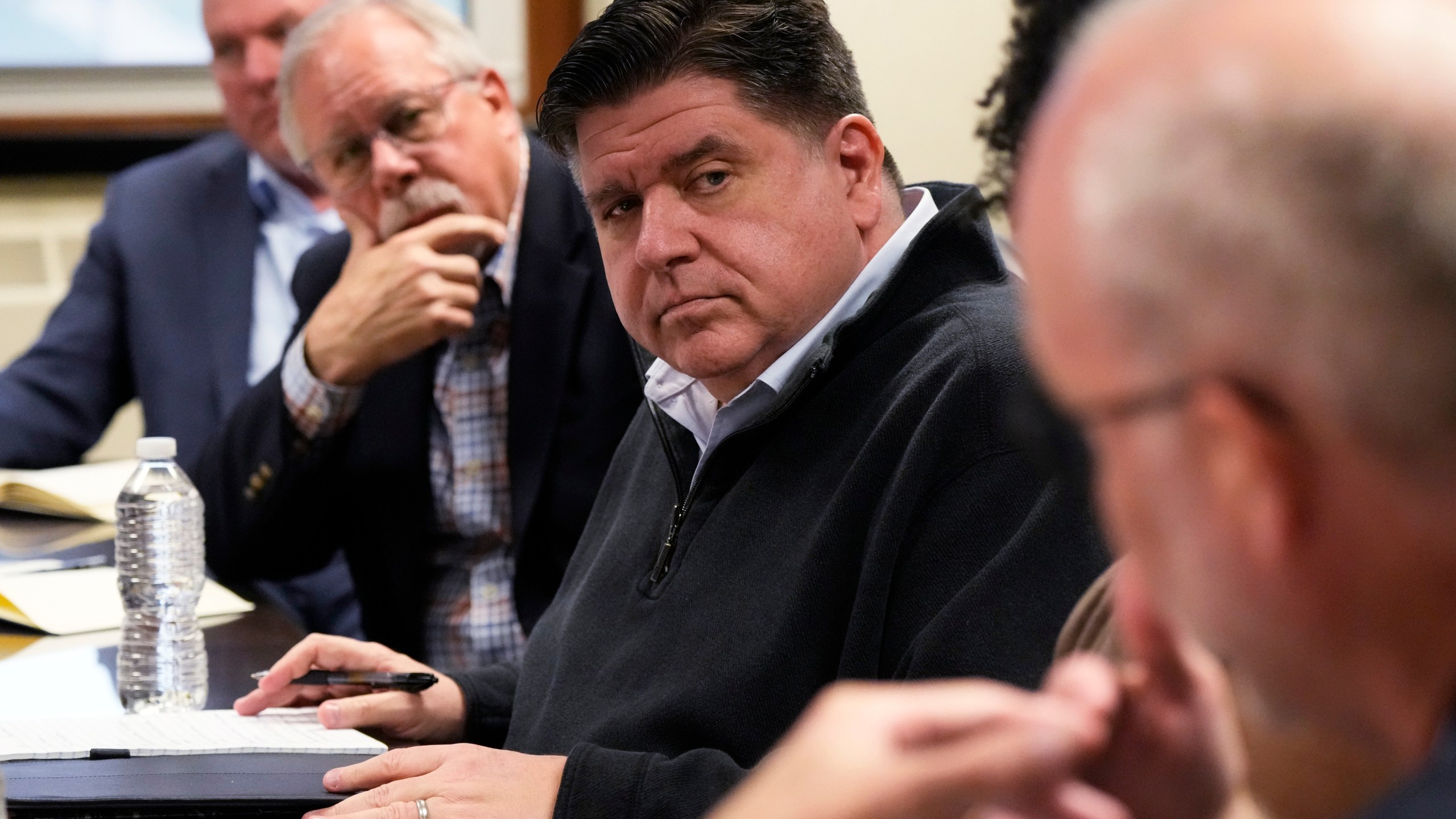 Illinois Gov. JB Pritzker listens to David Richardson, right, associate vice chancellor for research, during a visit to the Soybean Innovation Lab at University of Illinois, which is impacted by DOGE funding cuts, in Urbana, Ill., Wednesday, March 19, 2025. (AP Photo/Nam Y. Huh)