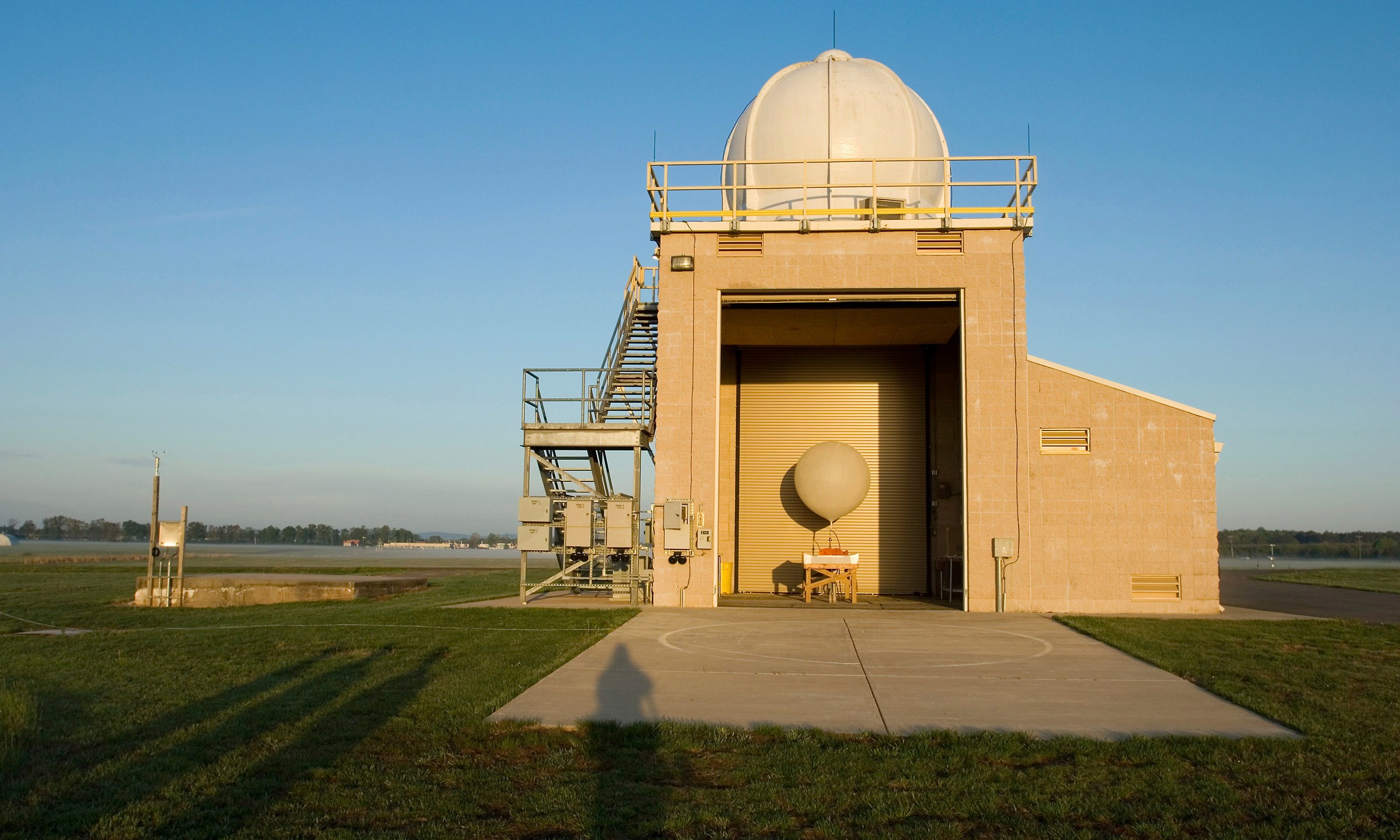 FILE - A National Weather Service weather balloon sits ready for launch in the Upper Air Inflation Building at the National Weather Service, April 27, 2006, in Sterling, Va. (AP Photo/Chris Greenberg, File)