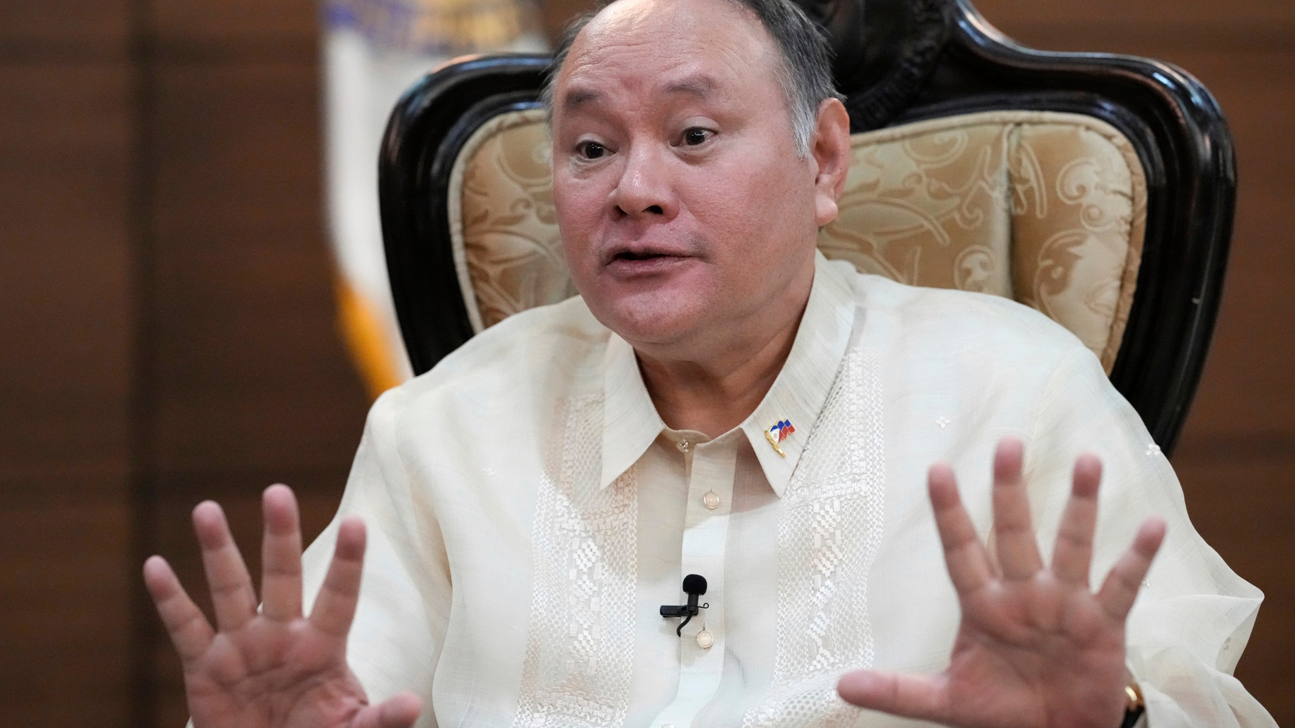 FILE - Philippine Defense Secretary Gilberto Teodoro gestures as he answers questions during an interview with the Associated Press at the Department of National Defense headquarters in Quezon city, Philippines on Wednesday, March 5, 2025. (AP Photo/Aaron Favila, file)