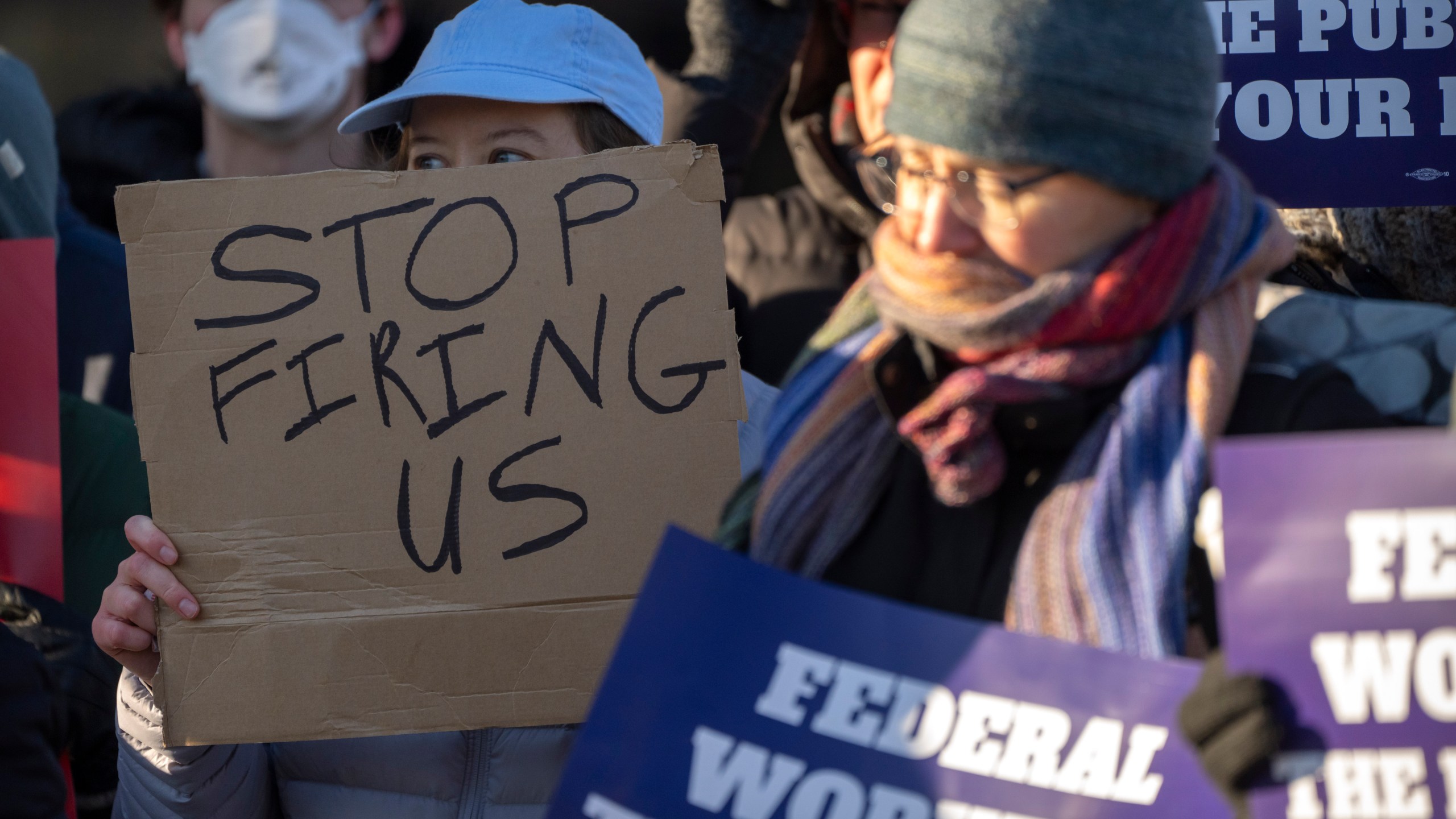 FILE - Demonstrators rally in support of federal workers outside of the Department of Health and Human Services, Feb. 14, 2025, in Washington. (AP Photo/Mark Schiefelbein, File)