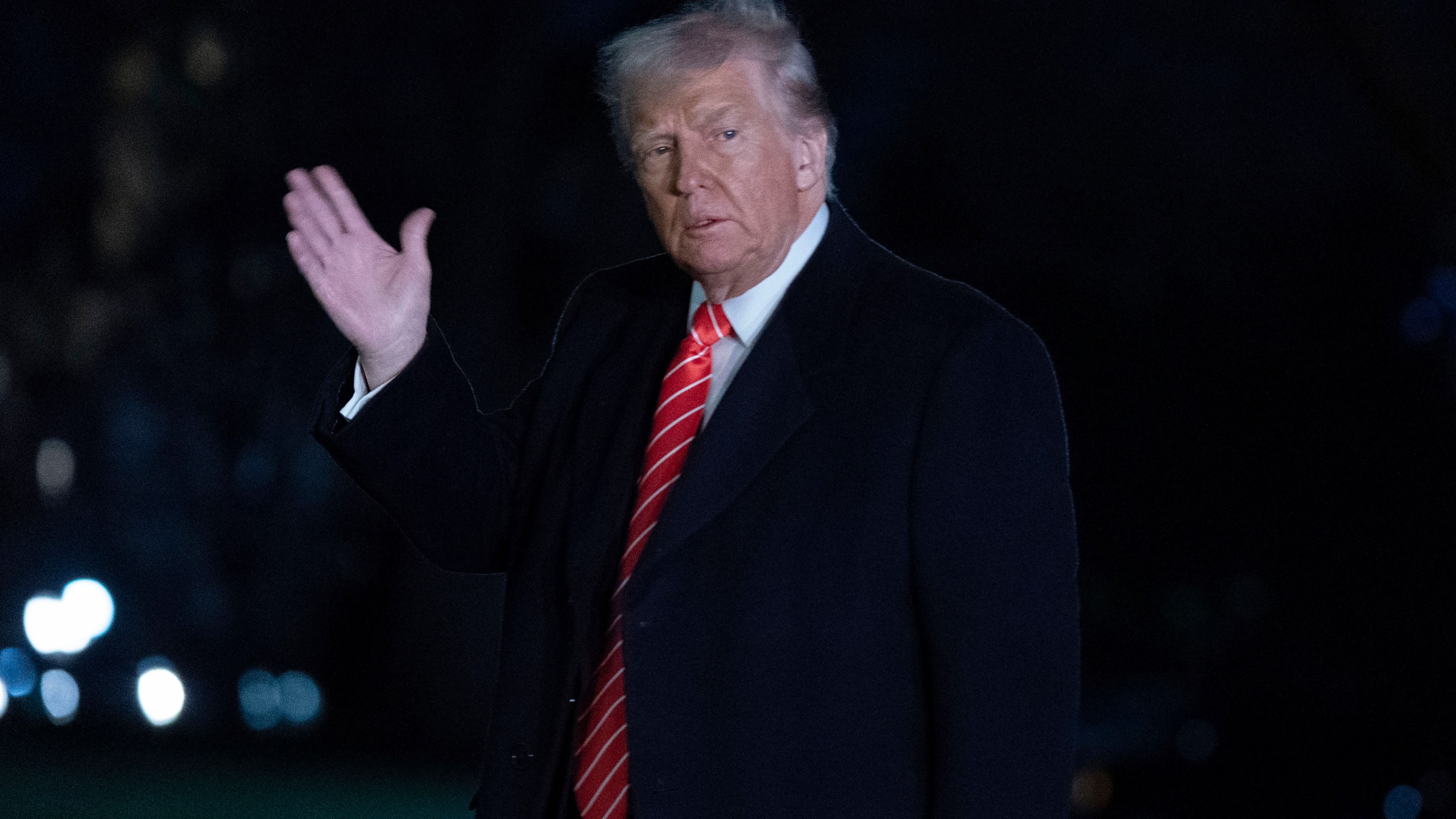 President Donald Trump waves to the media as he walks on the South Lawn of the White House, in Washington, Saturday, March 22, 2025. (AP Photo/Jose Luis Magana)