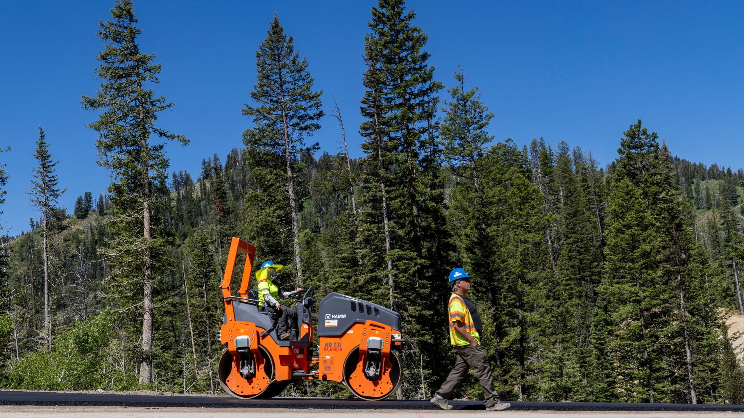 FILE - Construction takes place on the Teton Pass on June 25, 2024 near Jackson, Wyo. (AP Photo/Natalie Behring, File)