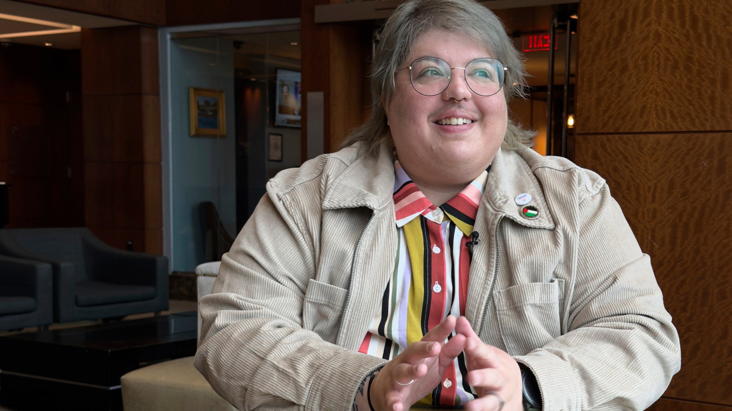 Ash Lazarus Orr, a transgender plaintiff in a lawsuit against the Trump administration's policy that bans the use of the "X" marker used by nonbinary people on passports, speaks during an interview with The Associated Press, Monday, March 24, 2025, in Boston. (AP Photo/Rodrique Ngowi)