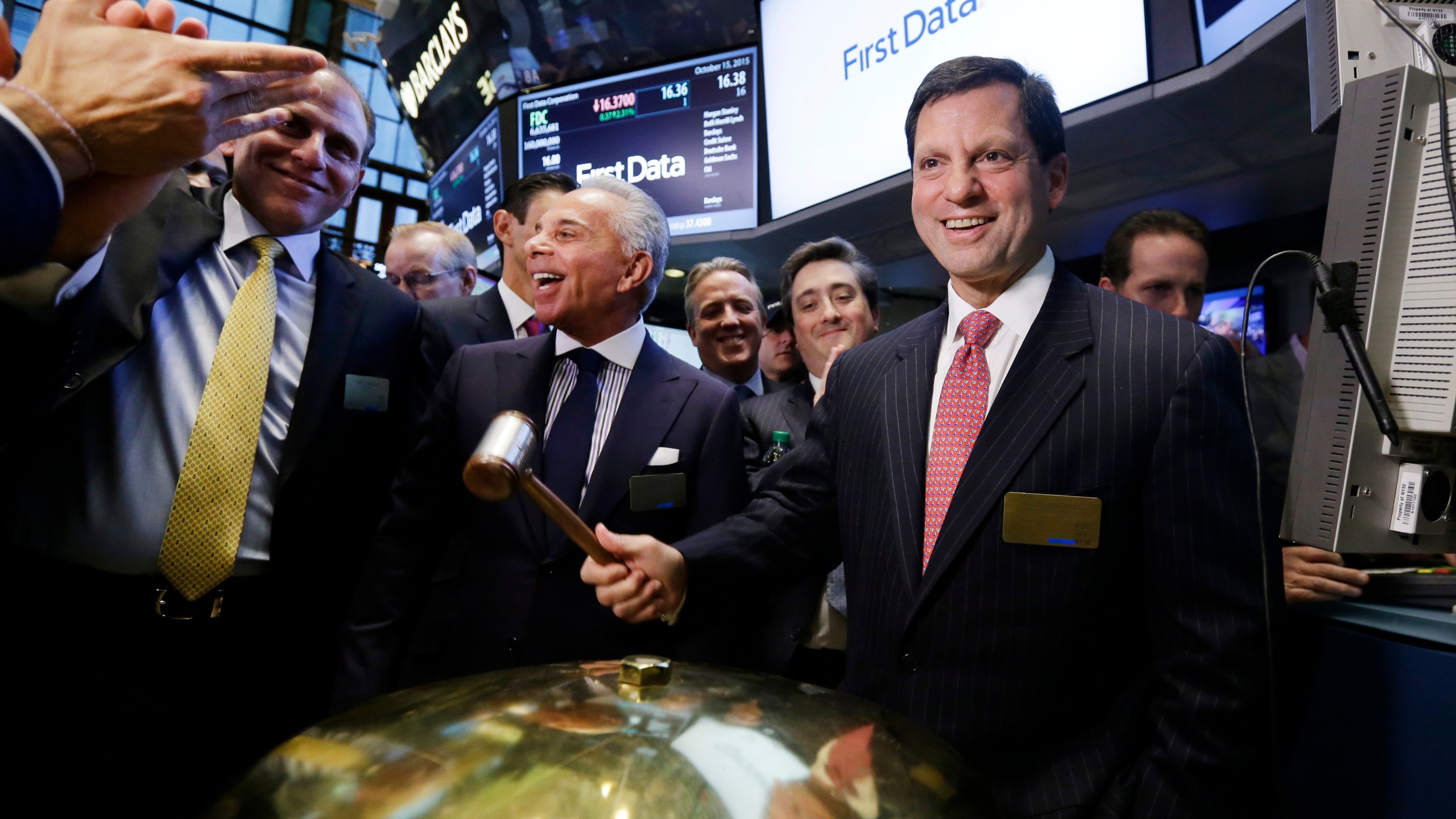 FILE - Frank Bisignano, right, then Chairman and CEO of First Data, smiles after the company's IPO at the New York Stock Exchange, Oct. 15, 2015. (AP Photo/Richard Drew, File)
