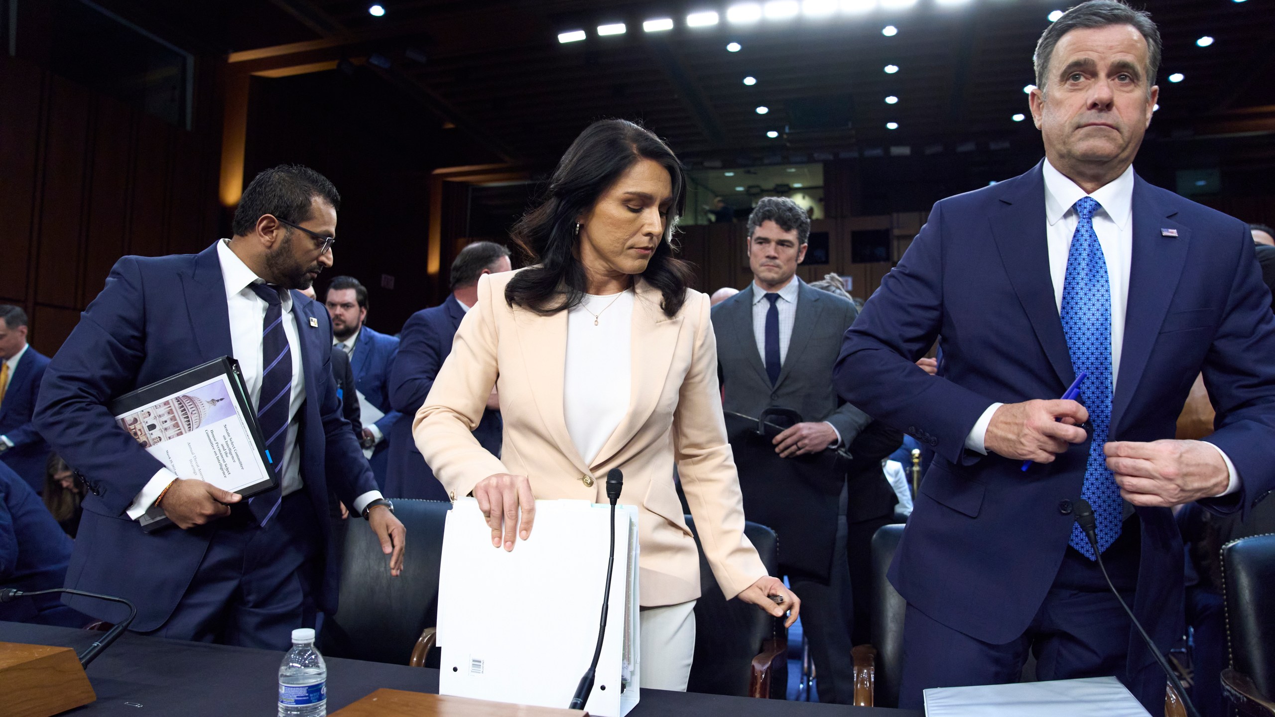 Director of National Intelligence Tulsi Gabbard, center, is flanked by FBI Director Kash Patel, left, and CIA Director John Ratcliffe, as the Senate Intelligence Committee holds its worldwide threats hearing, on Capitol Hill in Washington, Tuesday, March 25, 2025. (AP Photo/J. Scott Applewhite)