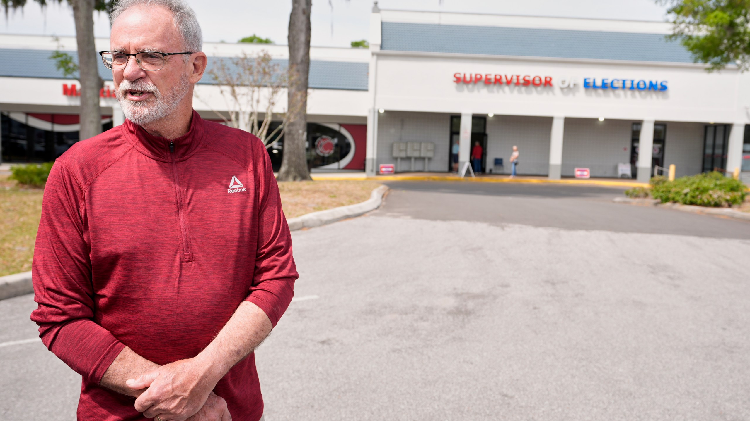 Early voter Gary Caples stands outside the Supervisor of Elections office Tuesday, March 25, 2025, in DeLand, Fla. (AP Photo/John Raoux)
