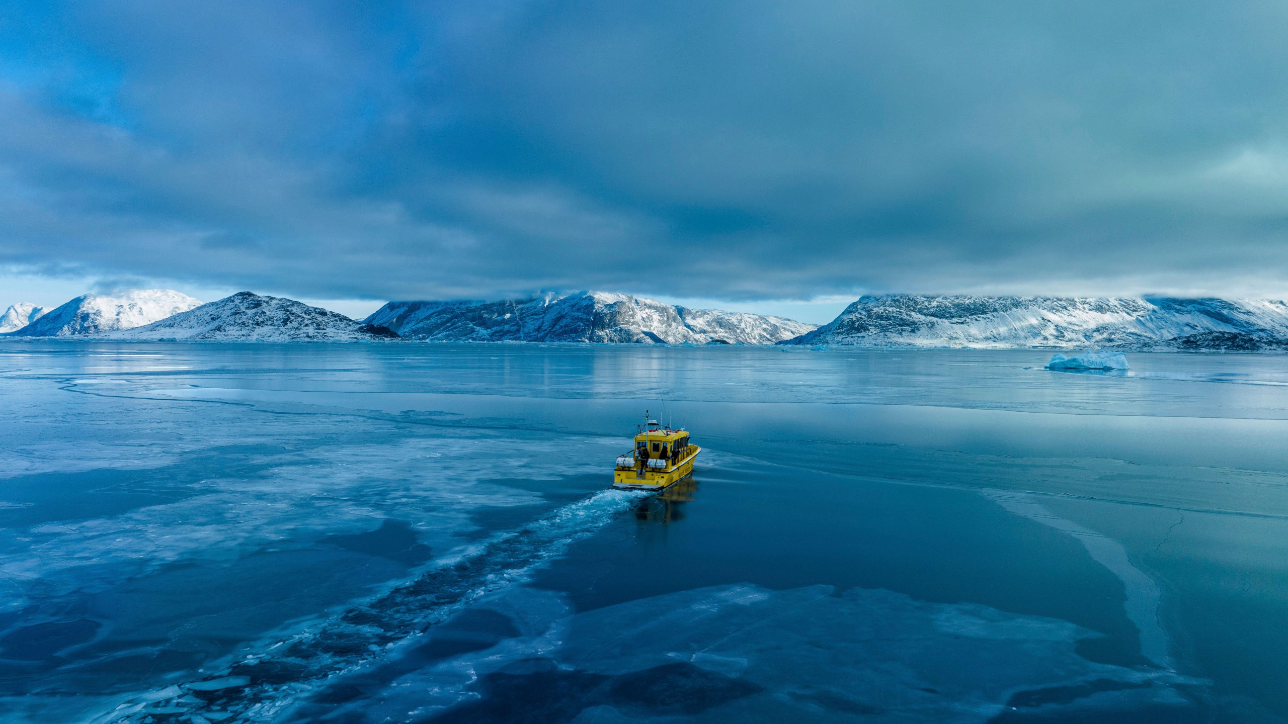 A boat rides though a frozen sea inlet outside of Nuuk, Greenland, March 6, 2025. (AP Photo/Evgeniy Maloletka)