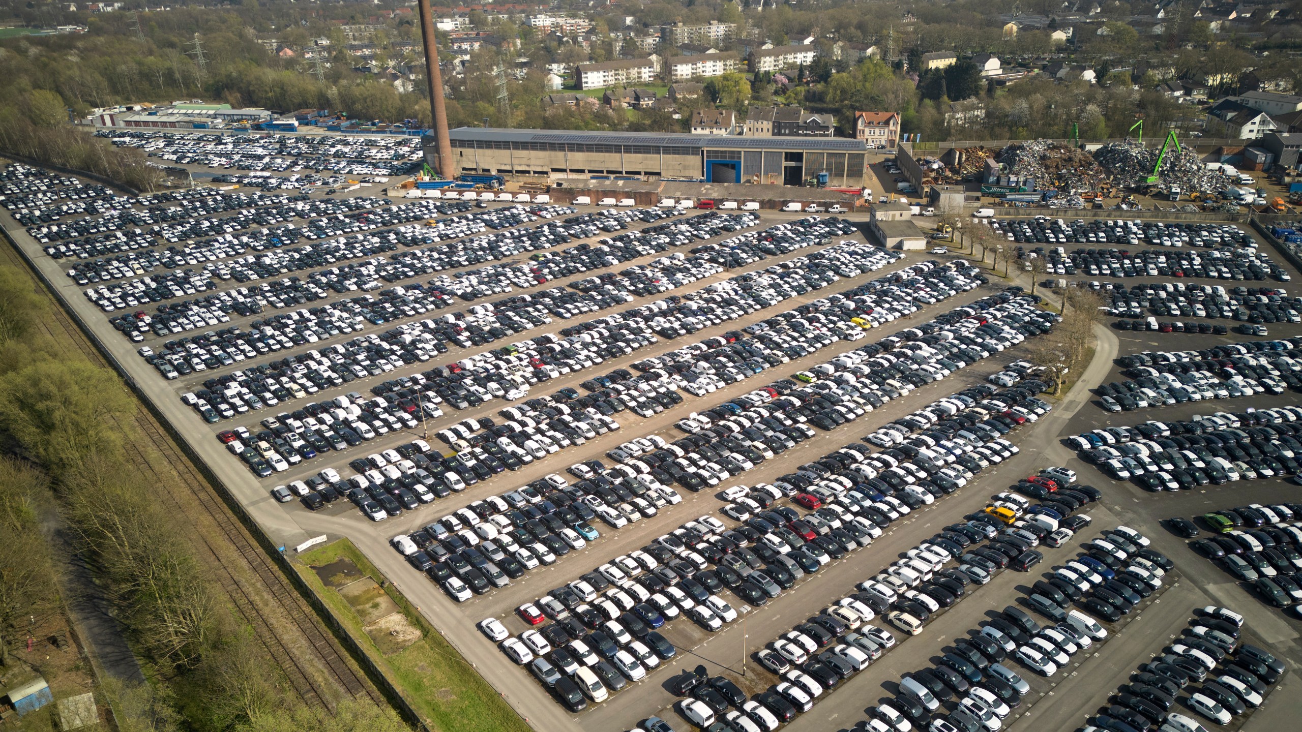 New German cars are stored at a logistic center in Essen, Germany, Thursday, March 27, 2025. (AP Photo/Martin Meissner)