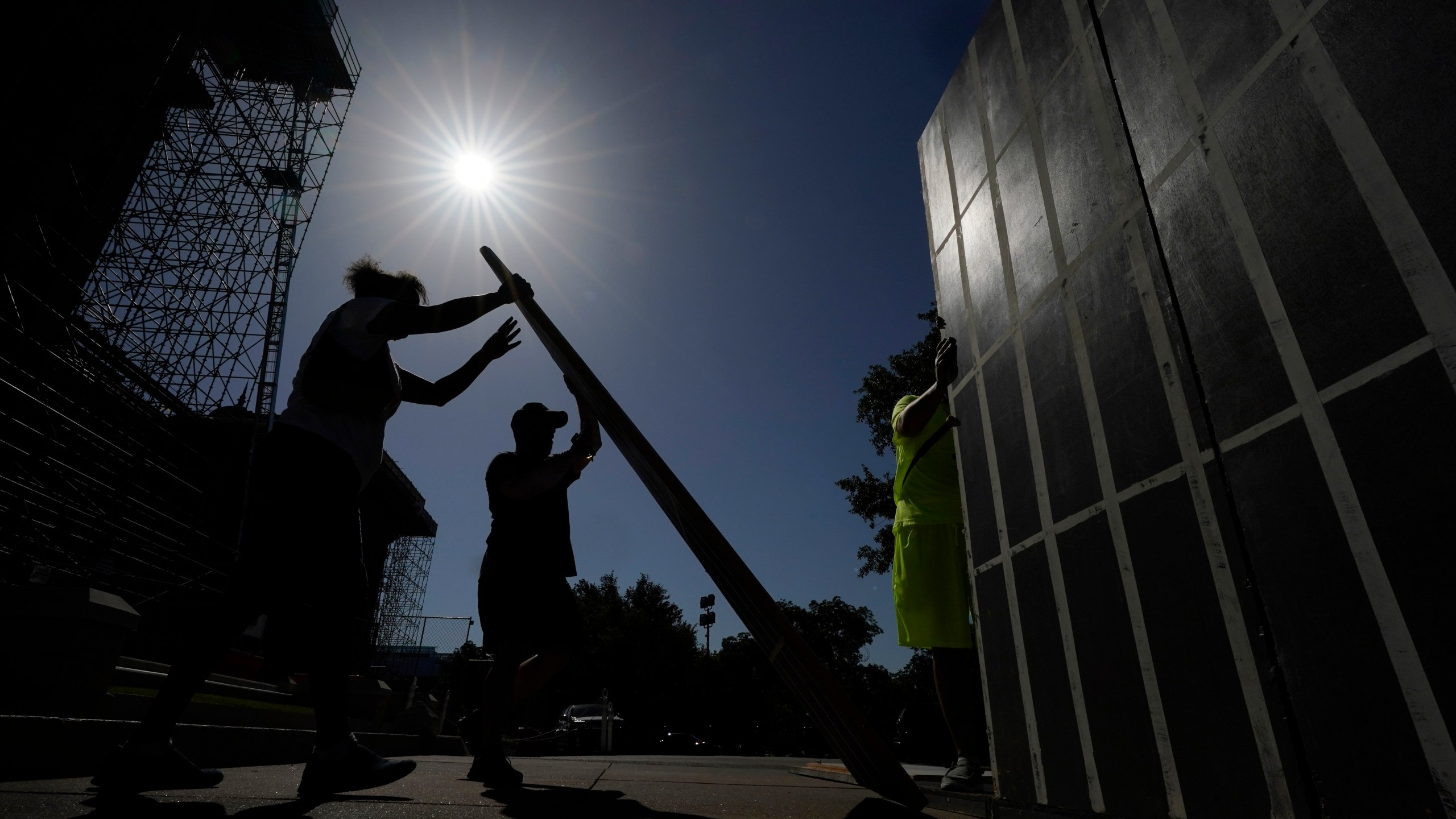 FILE - Advocates for cooling Texas prisons construct a makeshift cell before a rally on the steps of the Texas Capitol, Tuesday, July 18, 2023, in Austin, Texas. The group is called for an emergency special session to address the deadly heat effecting inmates. (AP Photo/Eric Gay, File)