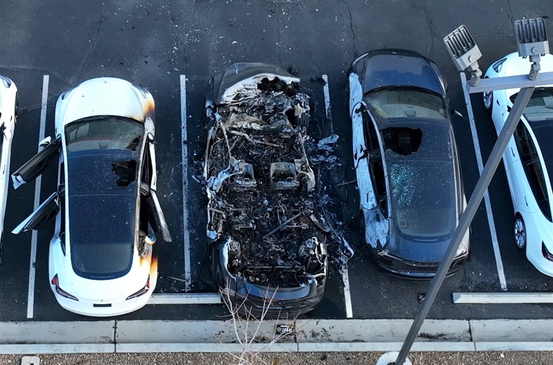 FILE - Police are investigating after several vehicles were set on fire at a Tesla service center, Tuesday, March 18, 2025, in Las Vegas. (Bizuayehu Tesfaye/Las Vegas Review-Journal via AP, File)/