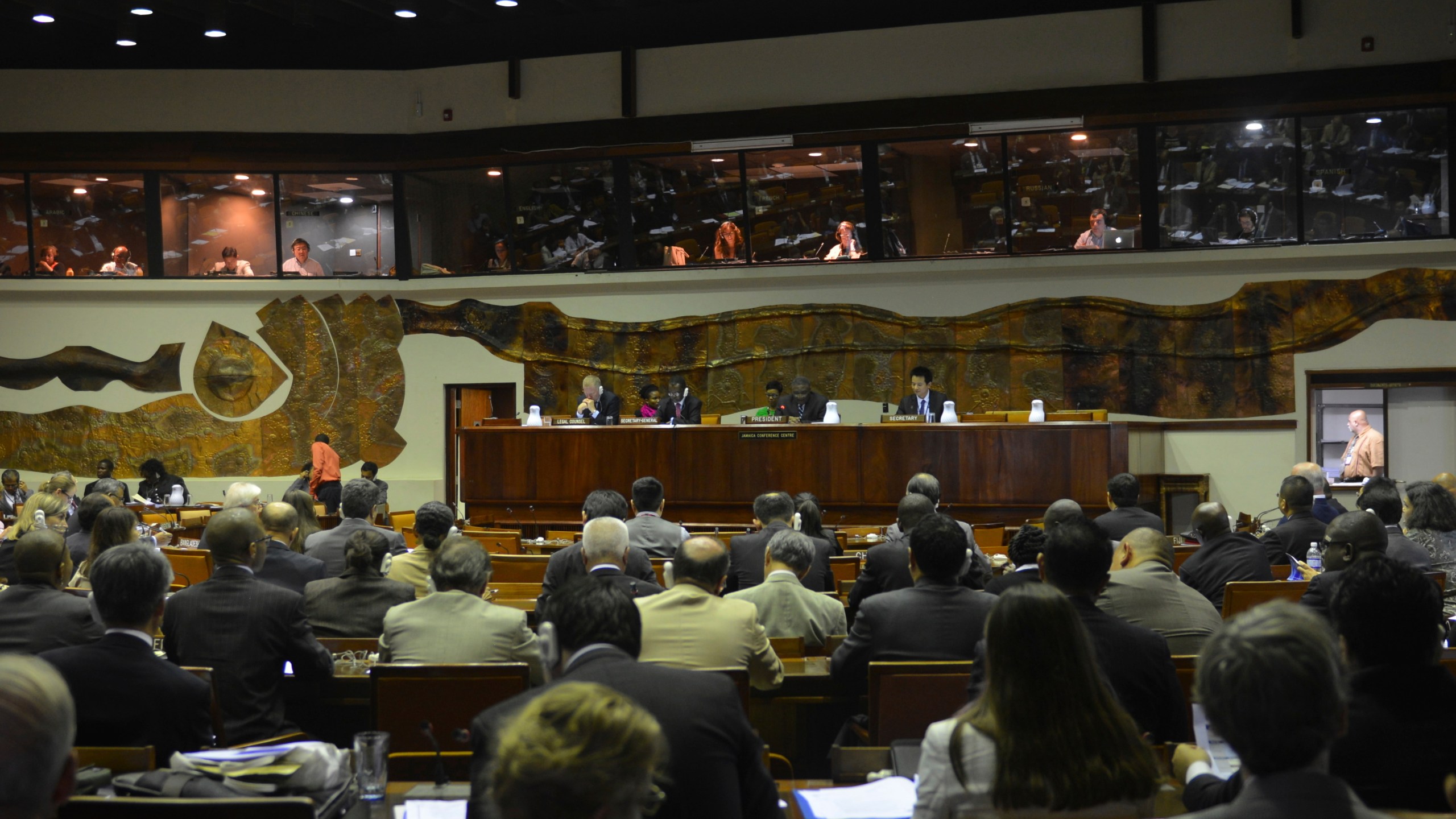 FILE - Delegates from across the world gather for a meeting by the International Seabed Authority (ISA), a U.N. body in Kingston, Jamaica, July 14, 2015. (AP Photo/David McFadden, File)