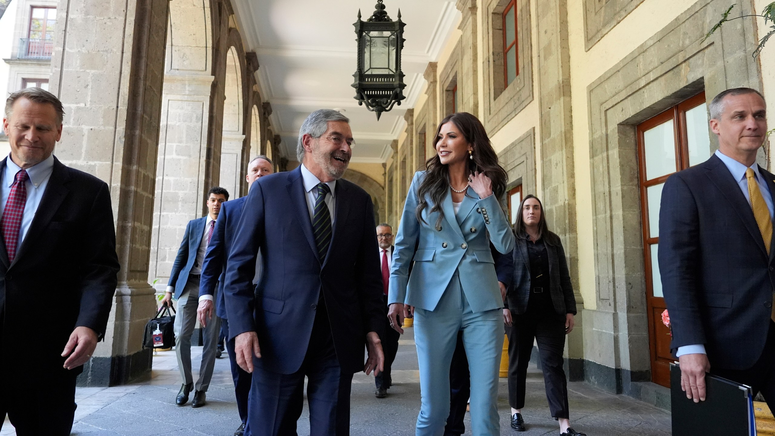 U.S. Homeland Security Secretary Kristi Noem, right, walks with Mexican Foreign Minister Juan Ramon de la Fuente at the National Palace in Mexico City, Friday, March 28, 2025. (AP Photo/Alex Brandon)