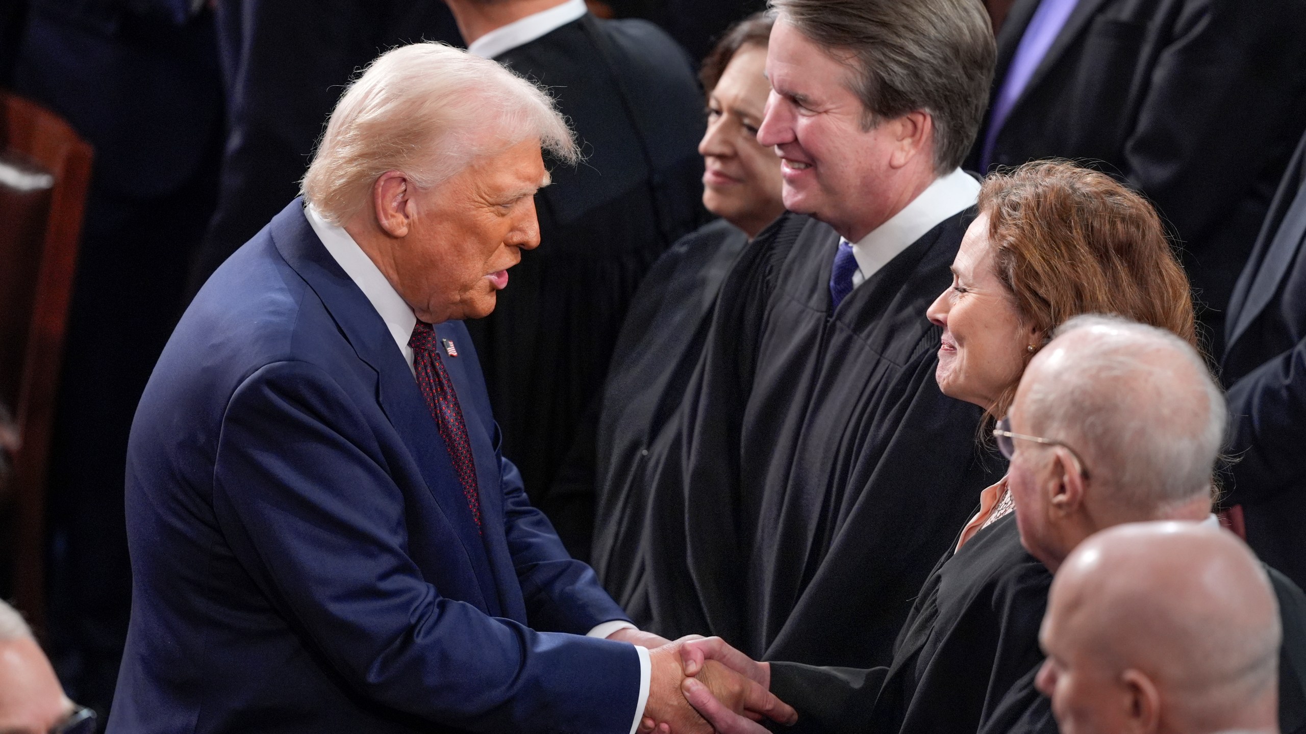 FILE - President Donald Trump, left, greets justices of the Supreme Court, from left, Elena Kagan, Brett Kavanaugh and Amy Coney Barrett, before addressing a joint session of Congress at the Capitol in Washington, March 4, 2025. (AP Photo/J. Scott Applewhite, File)