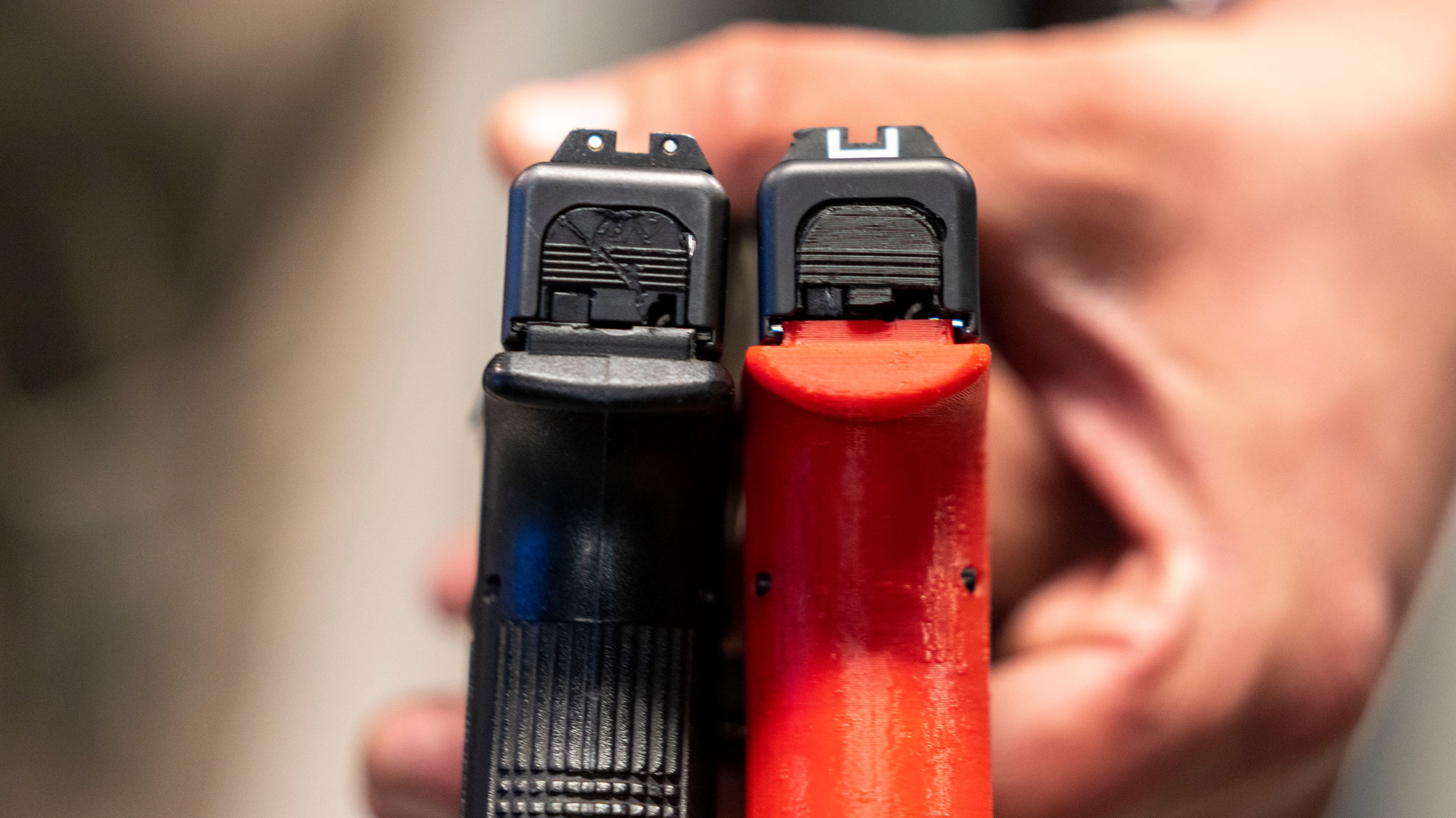 FILE - Two semi-automatic pistols are displayed for a photograph, one with a conversion device installed making it fully automatic, at the Bureau of Alcohol, Tobacco, Firearms, and Explosives (ATF), National Services Center, Thursday, March 2, 2023, in Martinsburg, W.Va. (AP Photo/Alex Brandon, File)